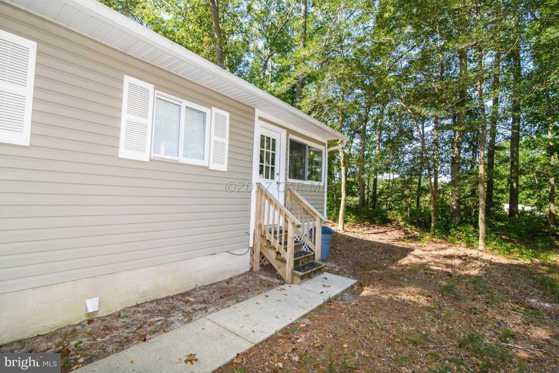 125 Pinehurst Road Ocean Pines, MD 21811 - Photo 47 of 49 a view of a house with backyard and trees