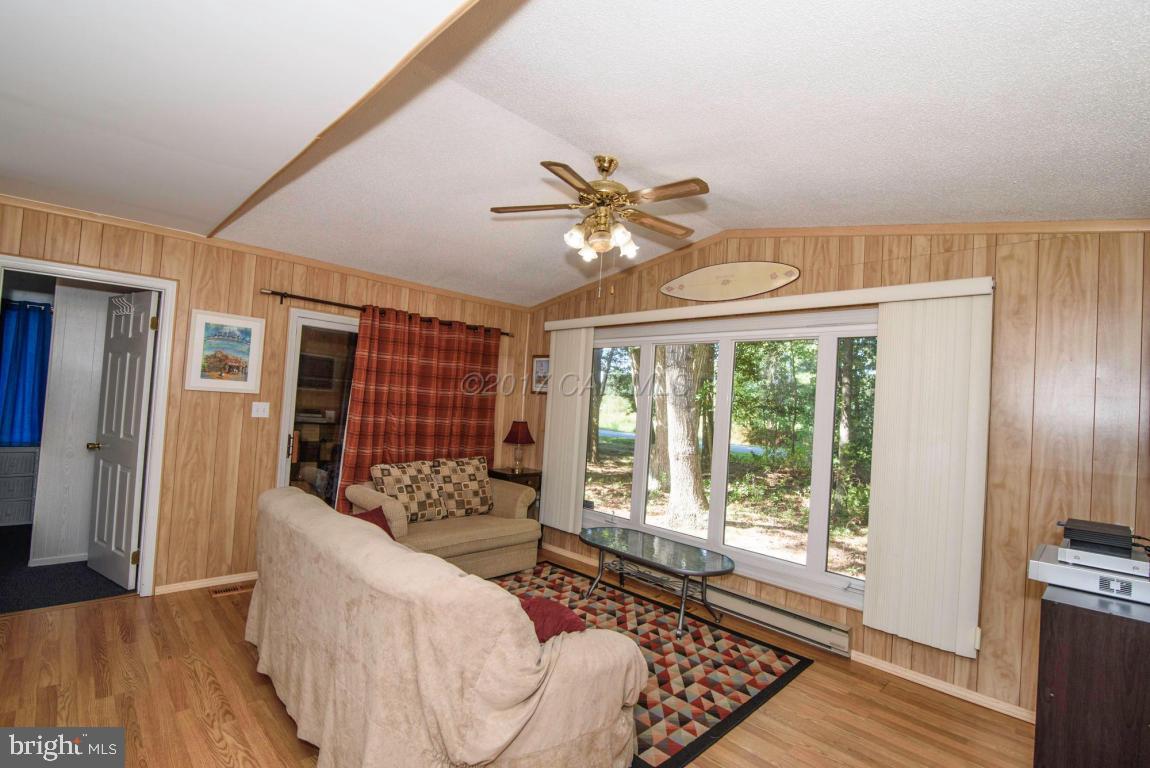 125 Pinehurst Road Ocean Pines, MD 21811 - Photo 6 of 49 a living room with furniture and a large window