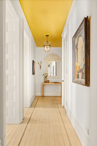 a view of a living room with a wooden floor