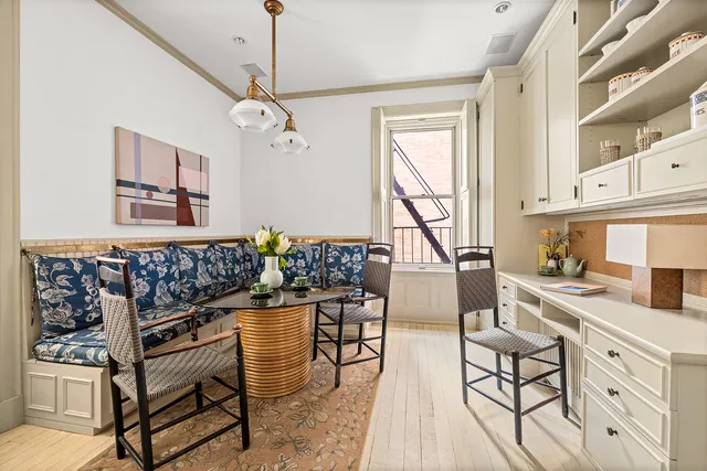 a kitchen with stainless steel appliances kitchen island granite countertop a stove a sink and a cabinets