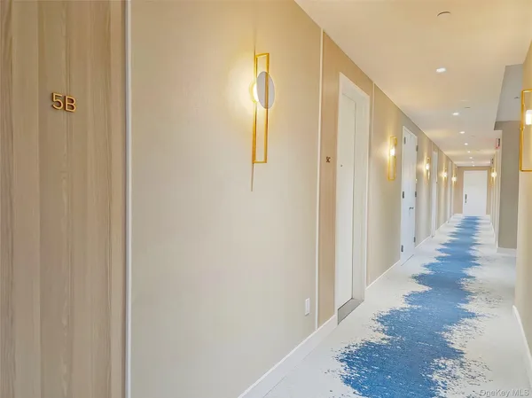 a view of a hallway with windows