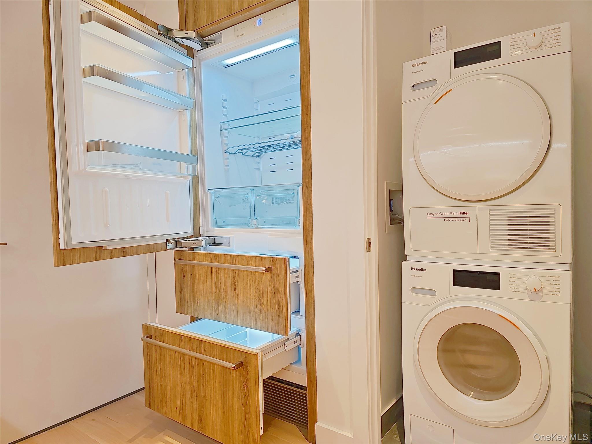 136-18 Maple Avenue, Unit 5B Queens, NY 11355 - Photo 15 of 31 a utility room with dryer and washer