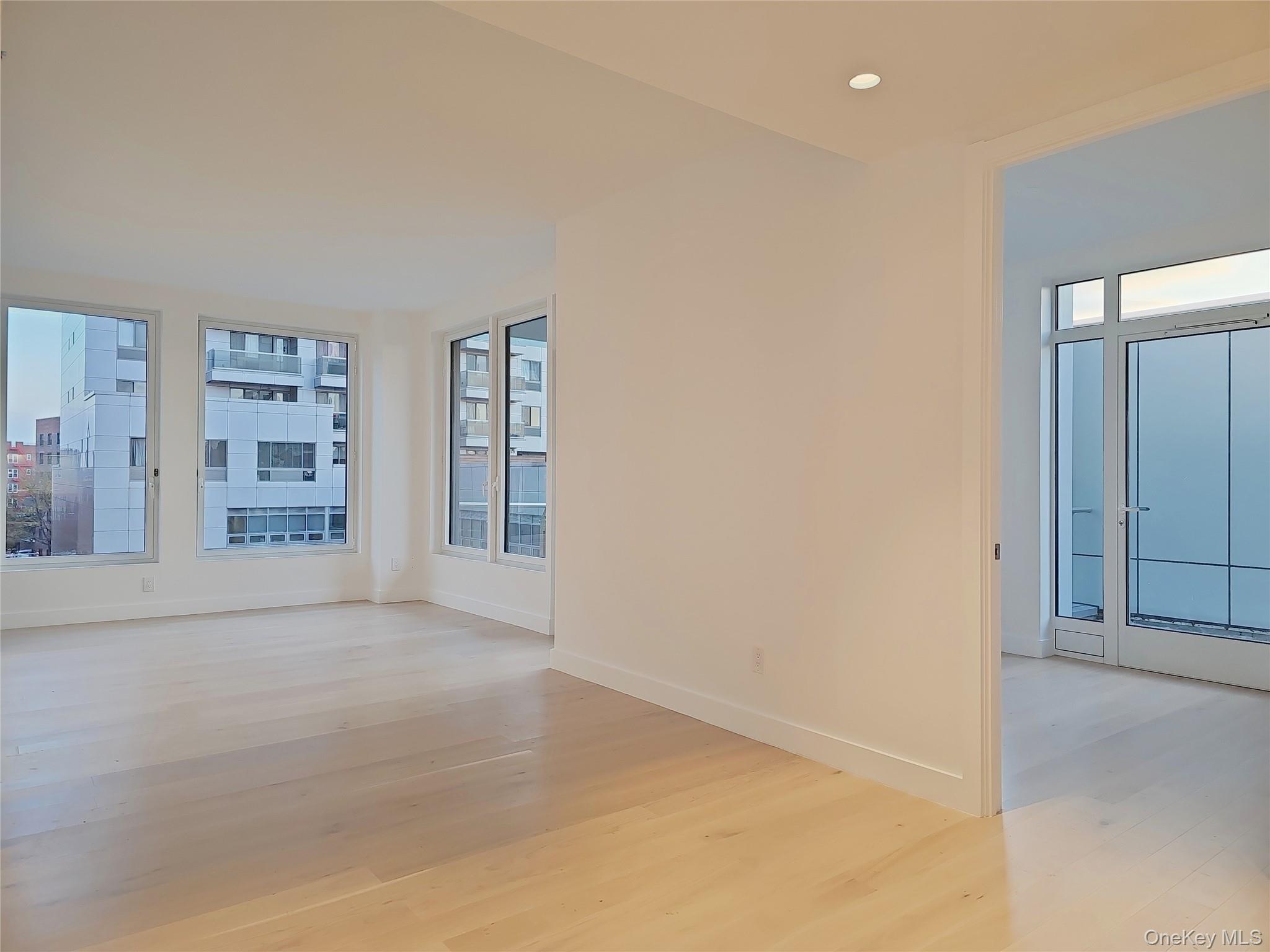 136-18 Maple Avenue, Unit 5B Queens, NY 11355 - Photo 16 of 31 an empty room with shelves