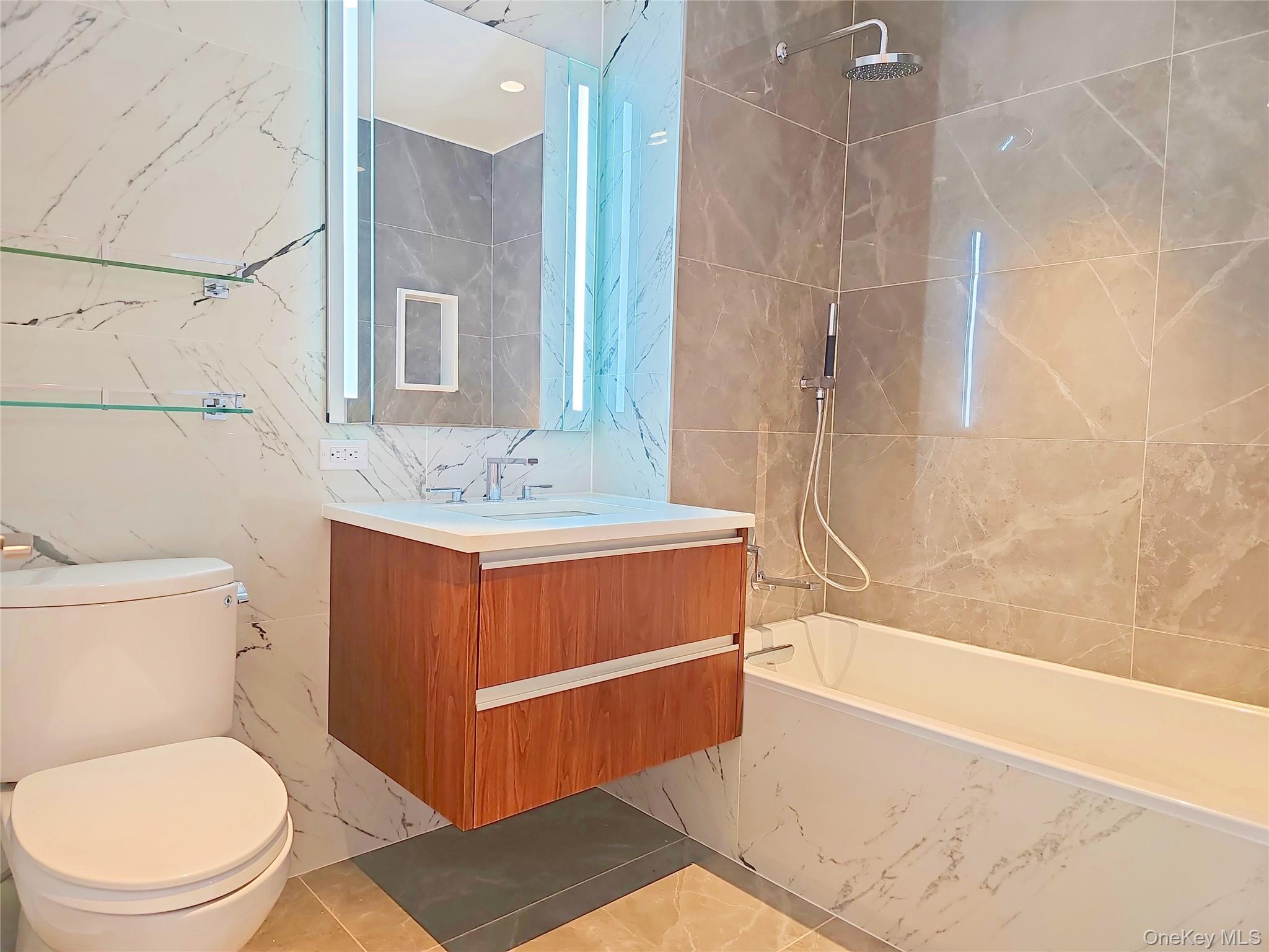 136-18 Maple Avenue, Unit 5B Queens, NY 11355 - Photo 17 of 31 a bathroom with a sink a toilet and shower