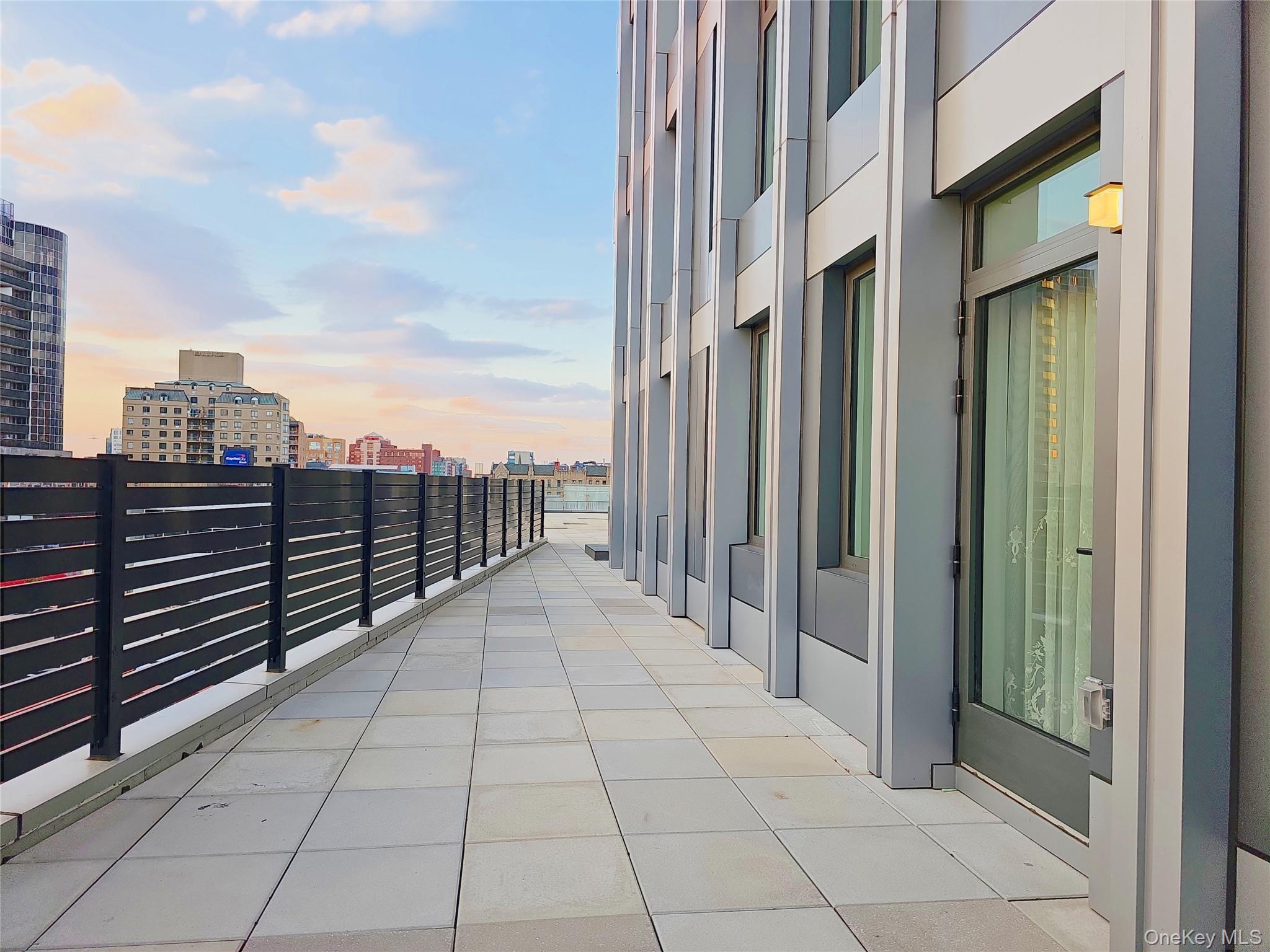 136-18 Maple Avenue, Unit 5B Queens, NY 11355 - Photo 19 of 31 a view of a terrace with sky view