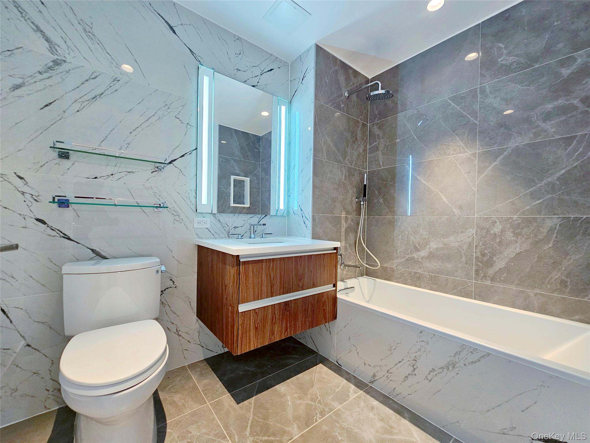 136-18 Maple Avenue, Unit 5B Queens, NY 11355 - Photo 26 of 31 a bathroom with a sink a toilet and shower