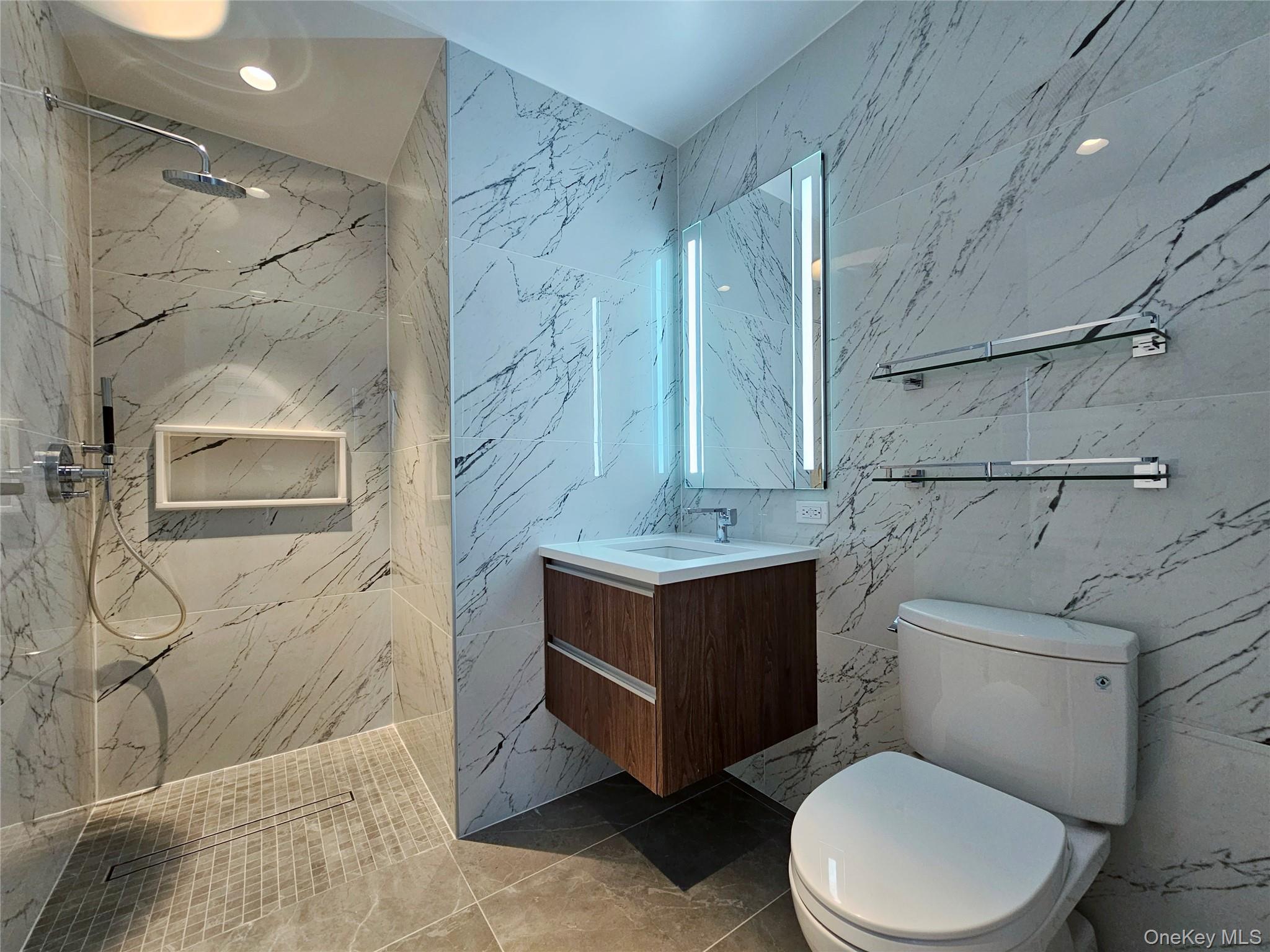 136-18 Maple Avenue, Unit 5B Queens, NY 11355 - Photo 27 of 31 a bathroom with a toilet sink and shower