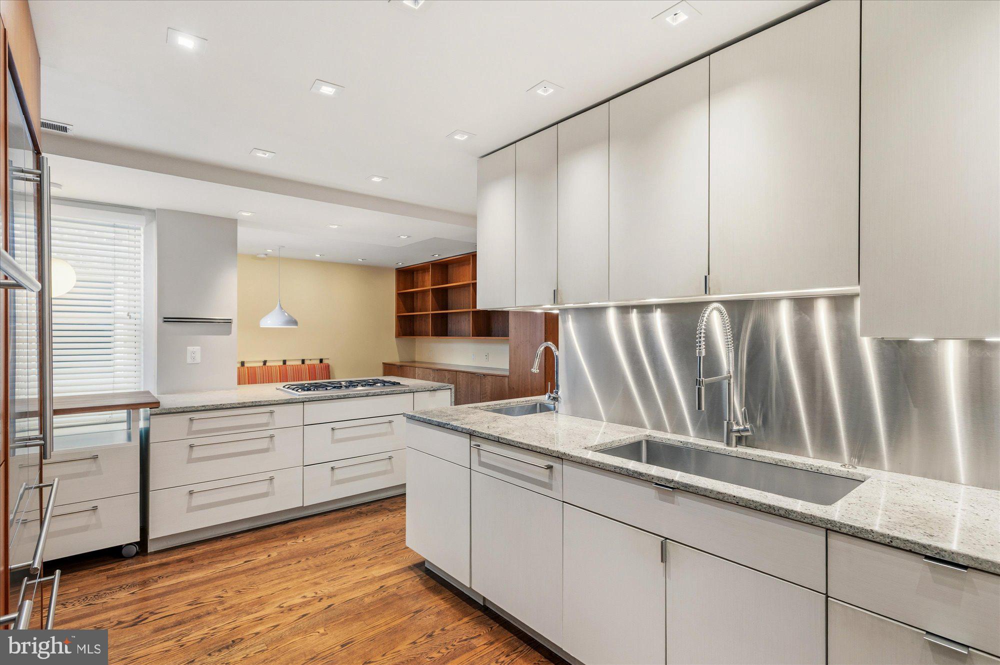 2101 Connecticut Avenue Northwest, Unit 53 Washington, DC 20009 - Photo 14 of 45 a kitchen with sink cabinets and window
