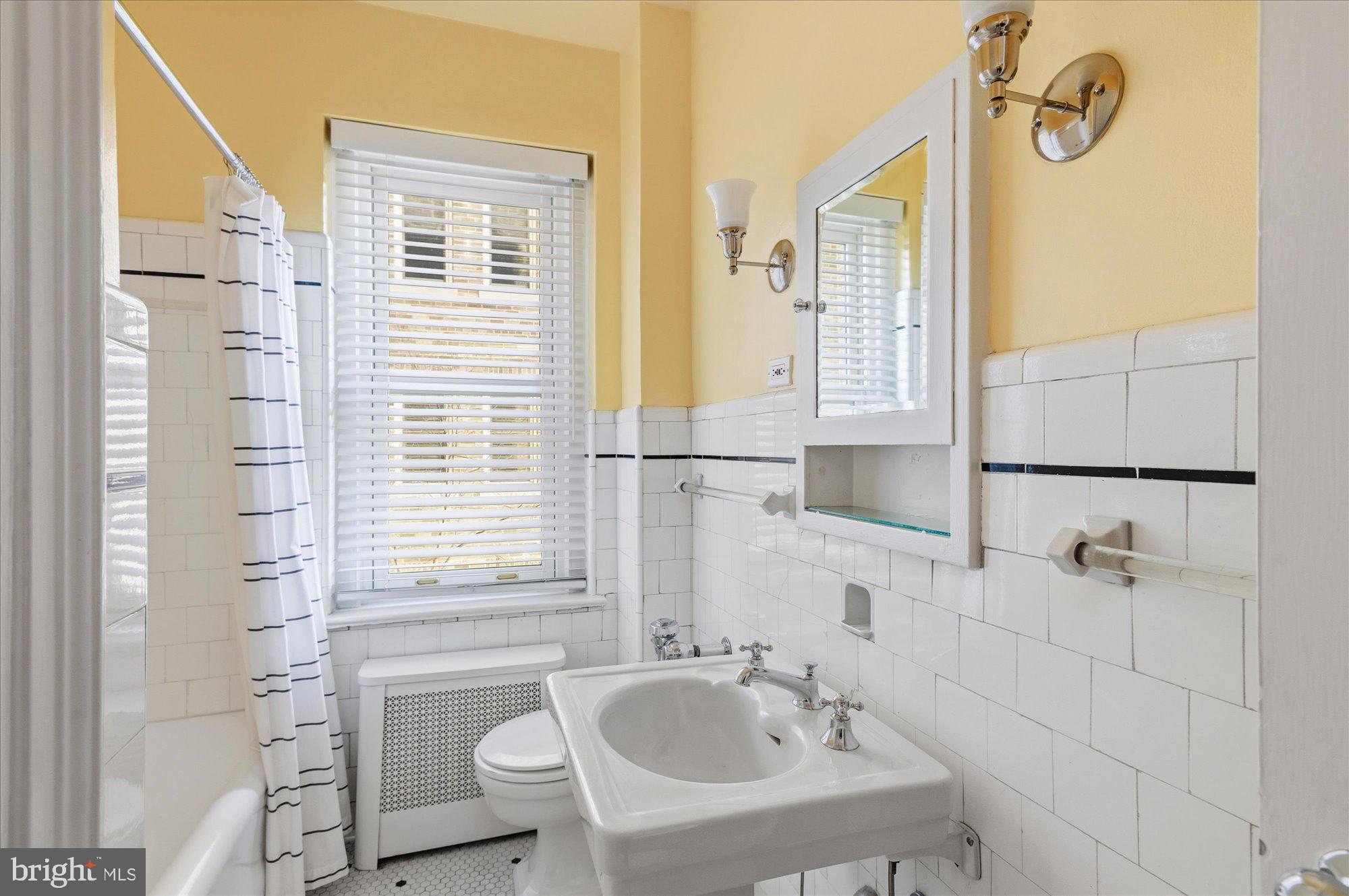 2101 Connecticut Avenue Northwest, Unit 53 Washington, DC 20009 - Photo 25 of 45 a bathroom with a sink and a bathtub