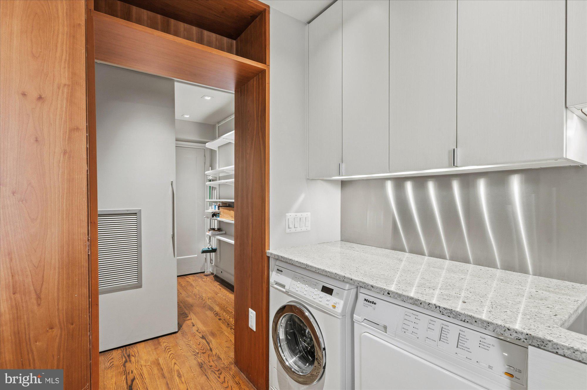 2101 Connecticut Avenue Northwest, Unit 53 Washington, DC 20009 - Photo 26 of 45 a utility room with dryer and washer