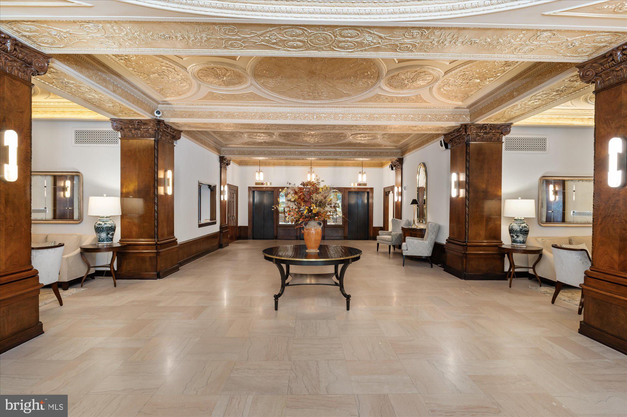 2101 Connecticut Avenue Northwest, Unit 53 Washington, DC 20009 - Photo 29 of 45 a living room with furniture and a chandelier