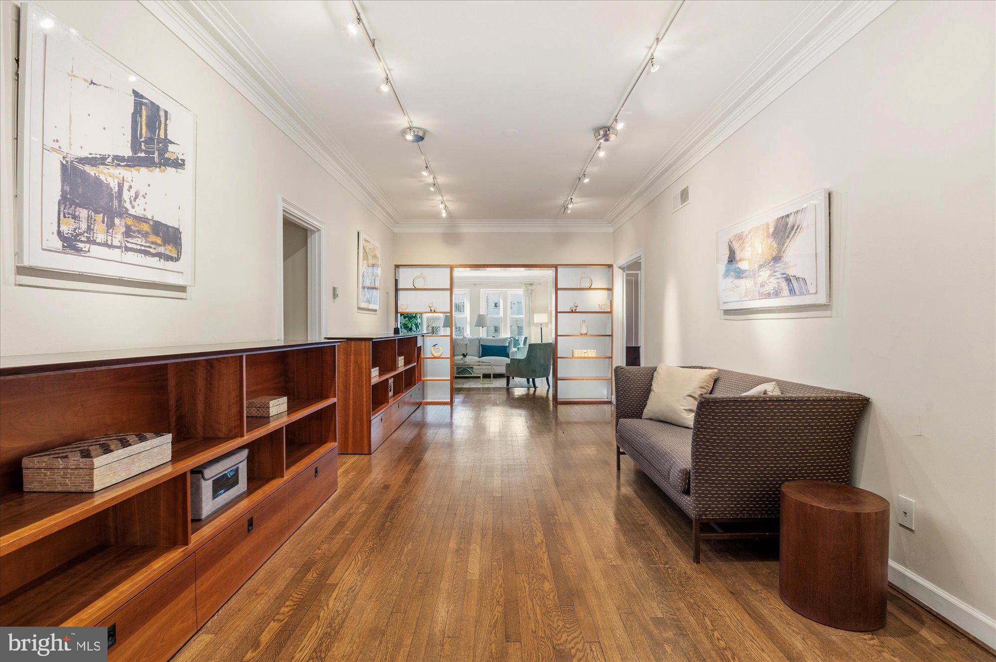 2101 Connecticut Avenue Northwest, Unit 53 Washington, DC 20009 - Photo 4 of 45 a living room with furniture and a wooden floor