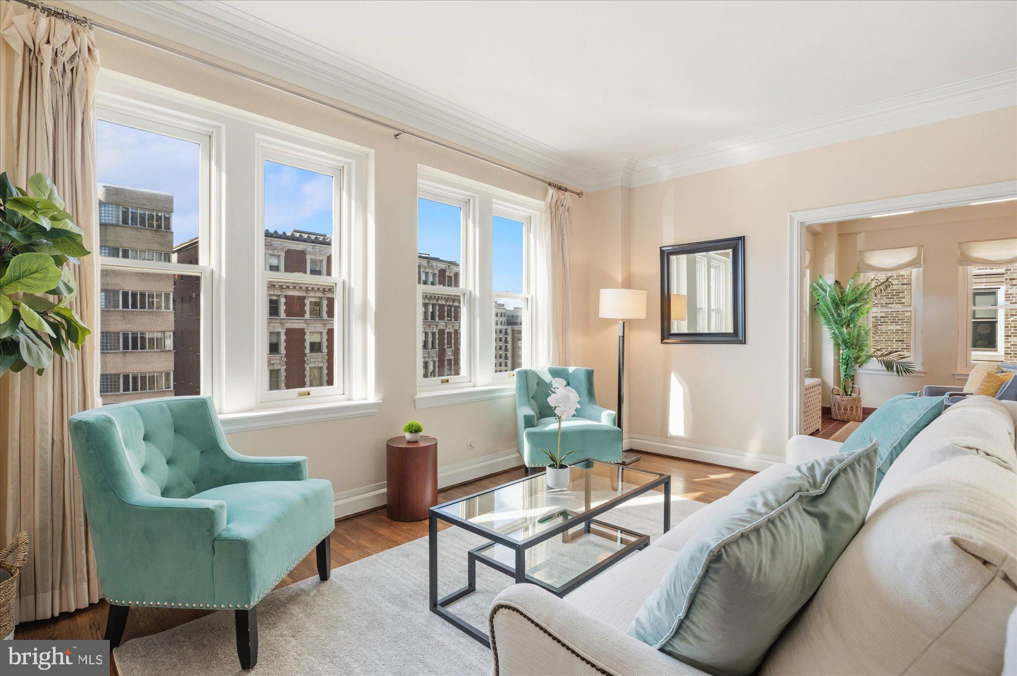 2101 Connecticut Avenue Northwest, Unit 53 Washington, DC 20009 - Photo 8 of 45 a living room with furniture and windows