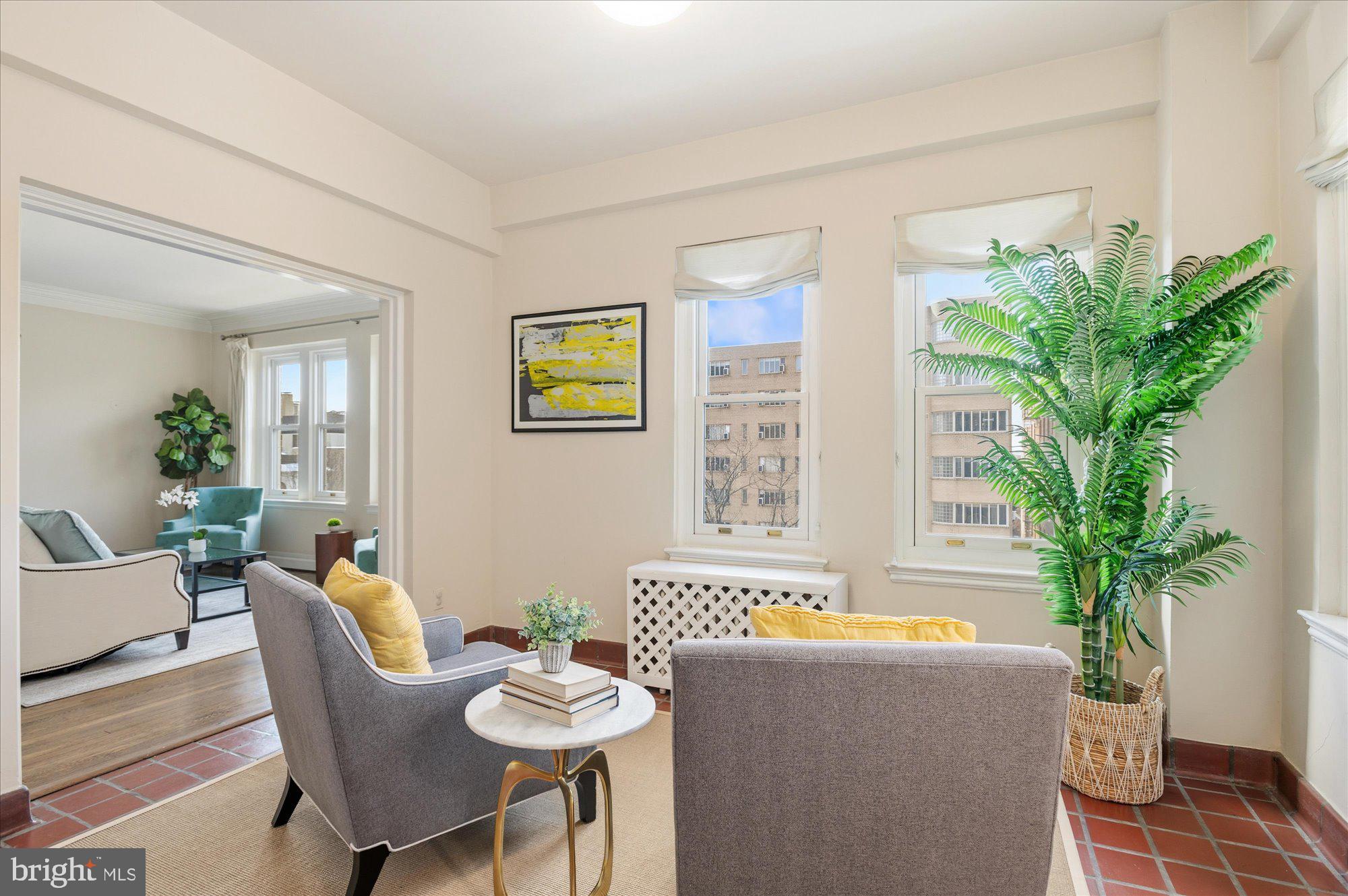 2101 Connecticut Avenue Northwest, Unit 53 Washington, DC 20009 - Photo 9 of 45 a living room with furniture potted plant and a window