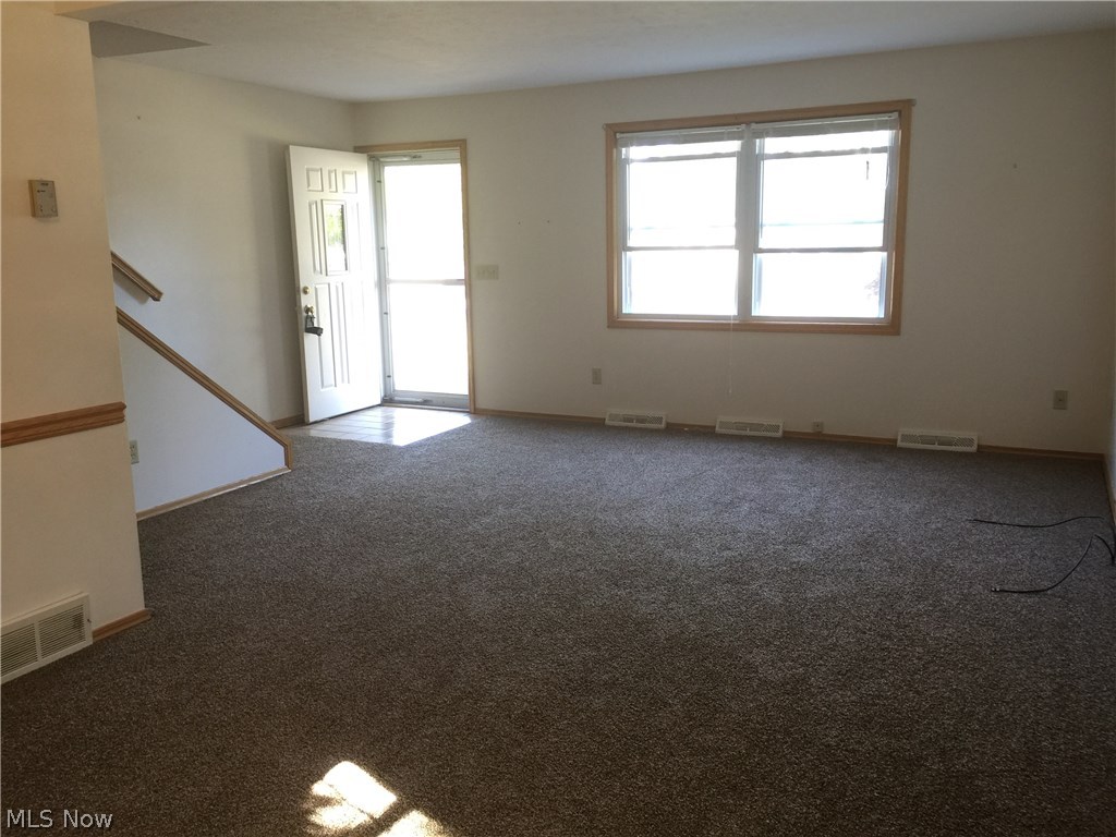 6330-6332 Manchester Road Parma, OH 44129 - Photo 21 of 24 Large Living room area with bright windows.