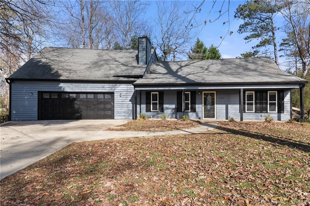 3260 Marine Road Cumming, GA 30041 - Photo 1 of 1 View of front facade with a porch and a garage