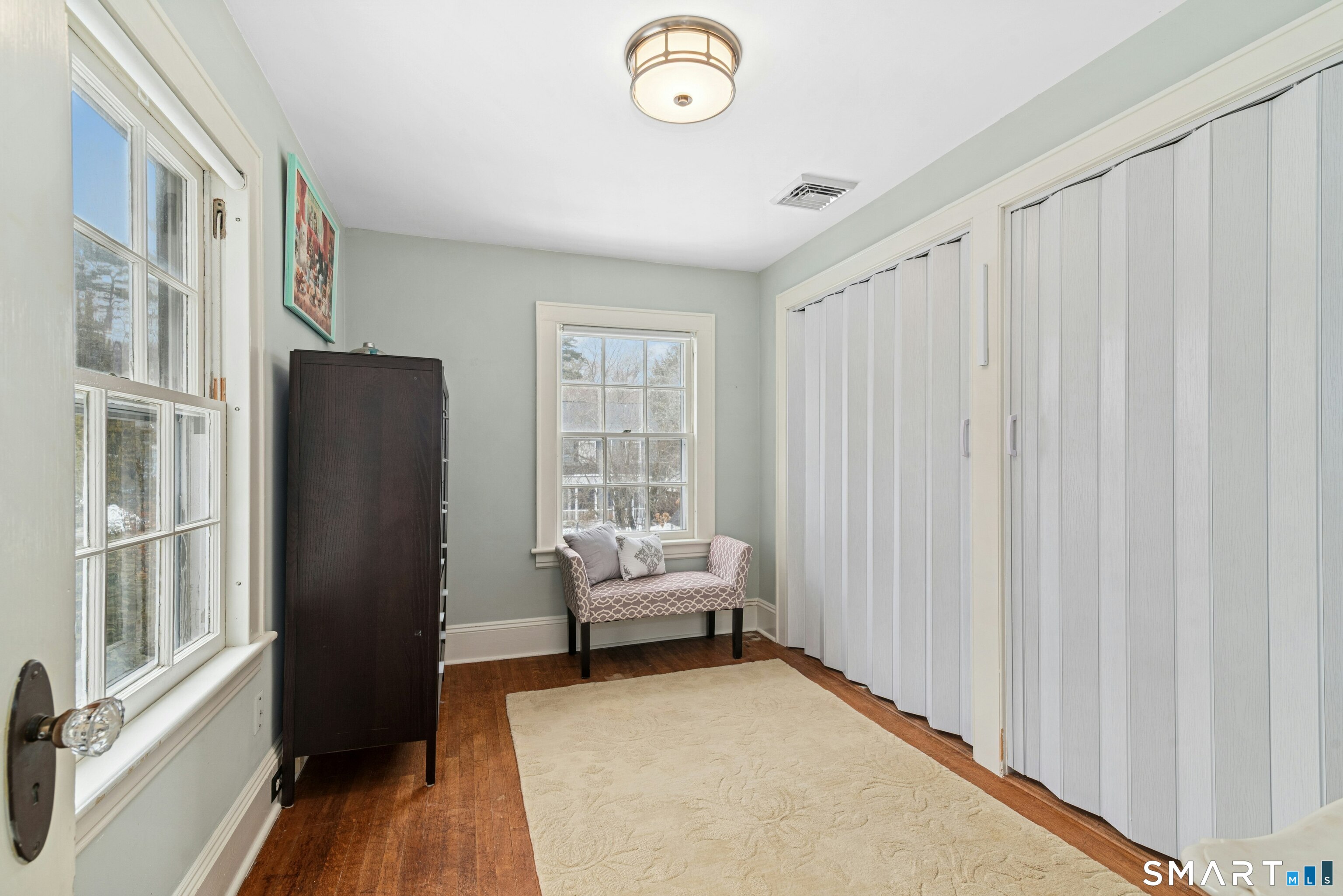 84 Algonquin Road Fairfield, CT 06825 - Photo 17 of 28 a living room with furniture and a window