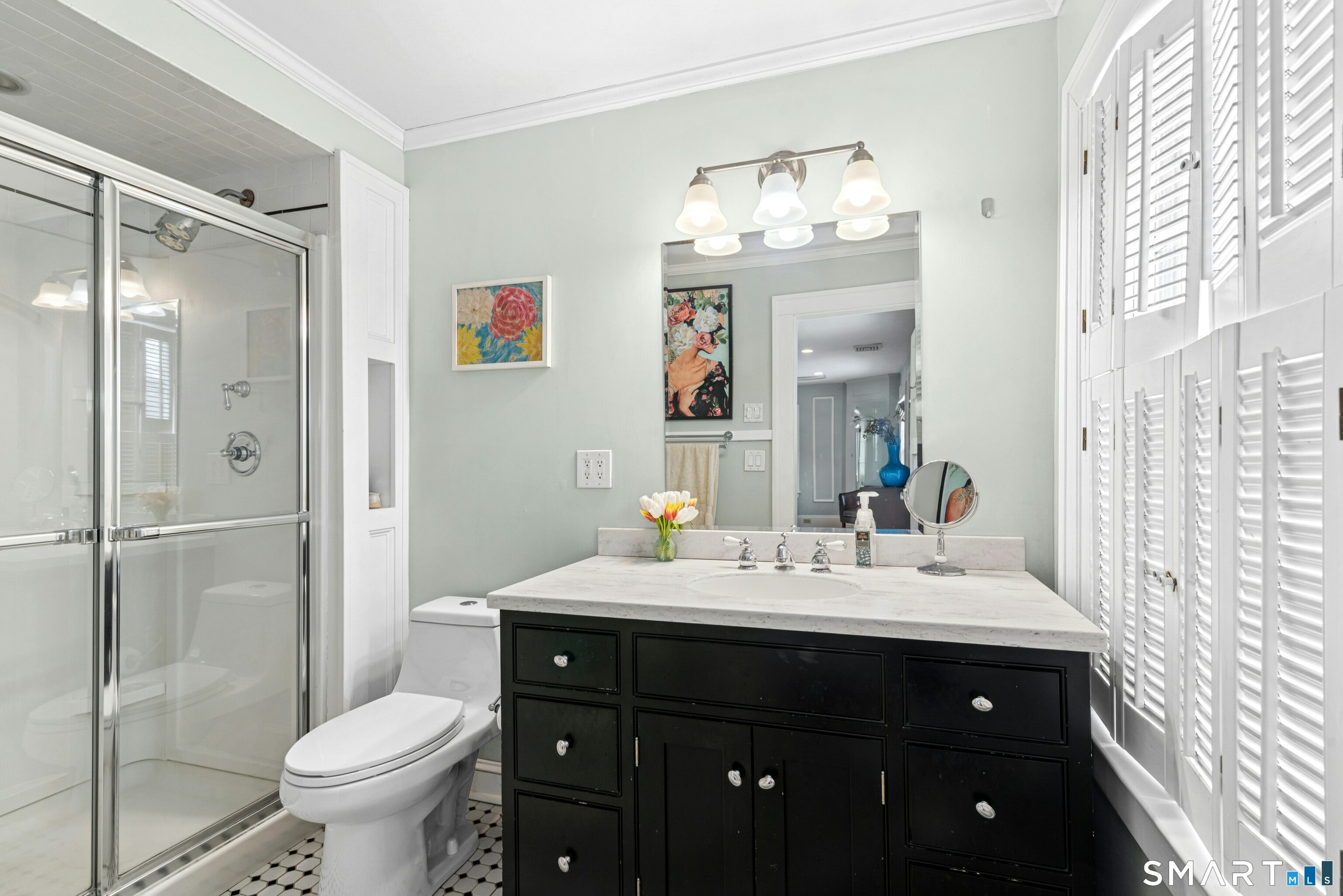 84 Algonquin Road Fairfield, CT 06825 - Photo 18 of 28 a bathroom with a sink vanity mirror and toilet