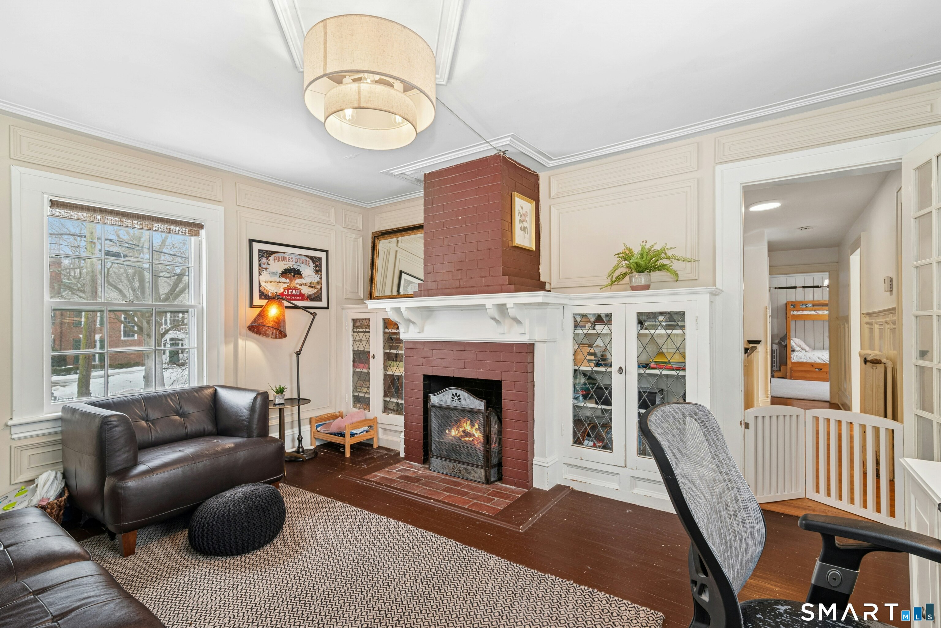 84 Algonquin Road Fairfield, CT 06825 - Photo 20 of 28 a living room with furniture a window and a fireplace
