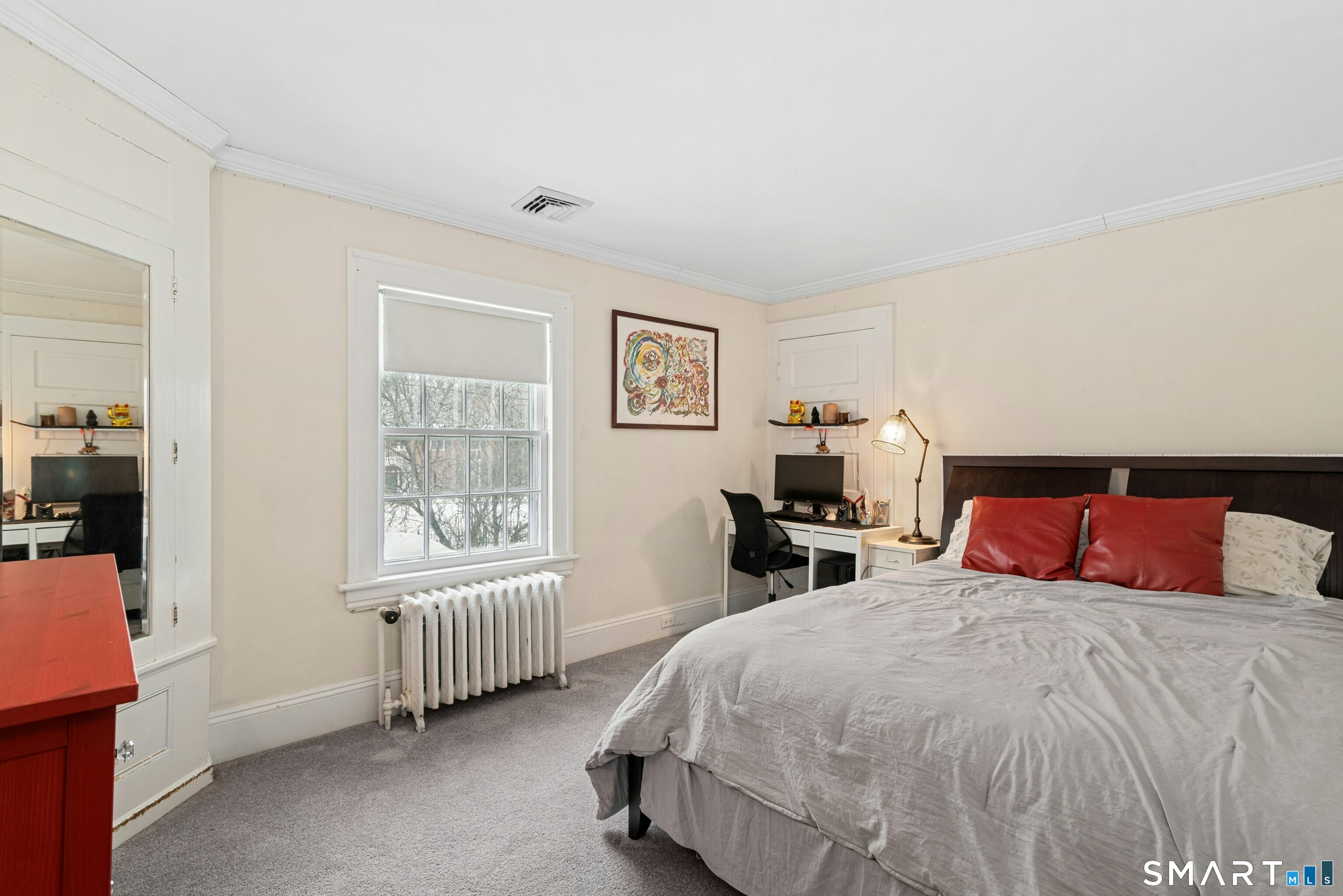 84 Algonquin Road Fairfield, CT 06825 - Photo 21 of 28 a bedroom with a bed and a window