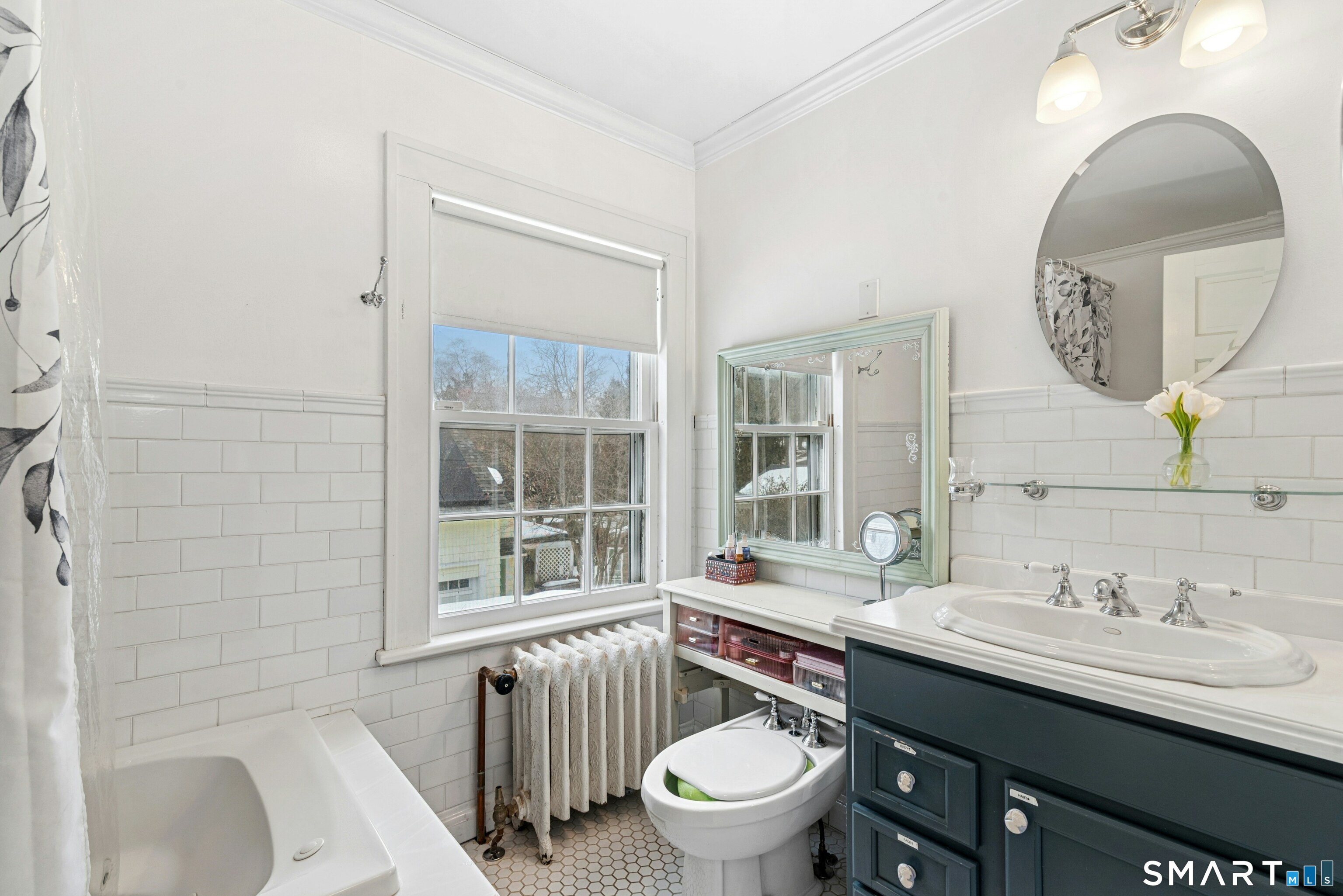 84 Algonquin Road Fairfield, CT 06825 - Photo 23 of 28 a bathroom with a granite countertop toilet a sink and a mirror