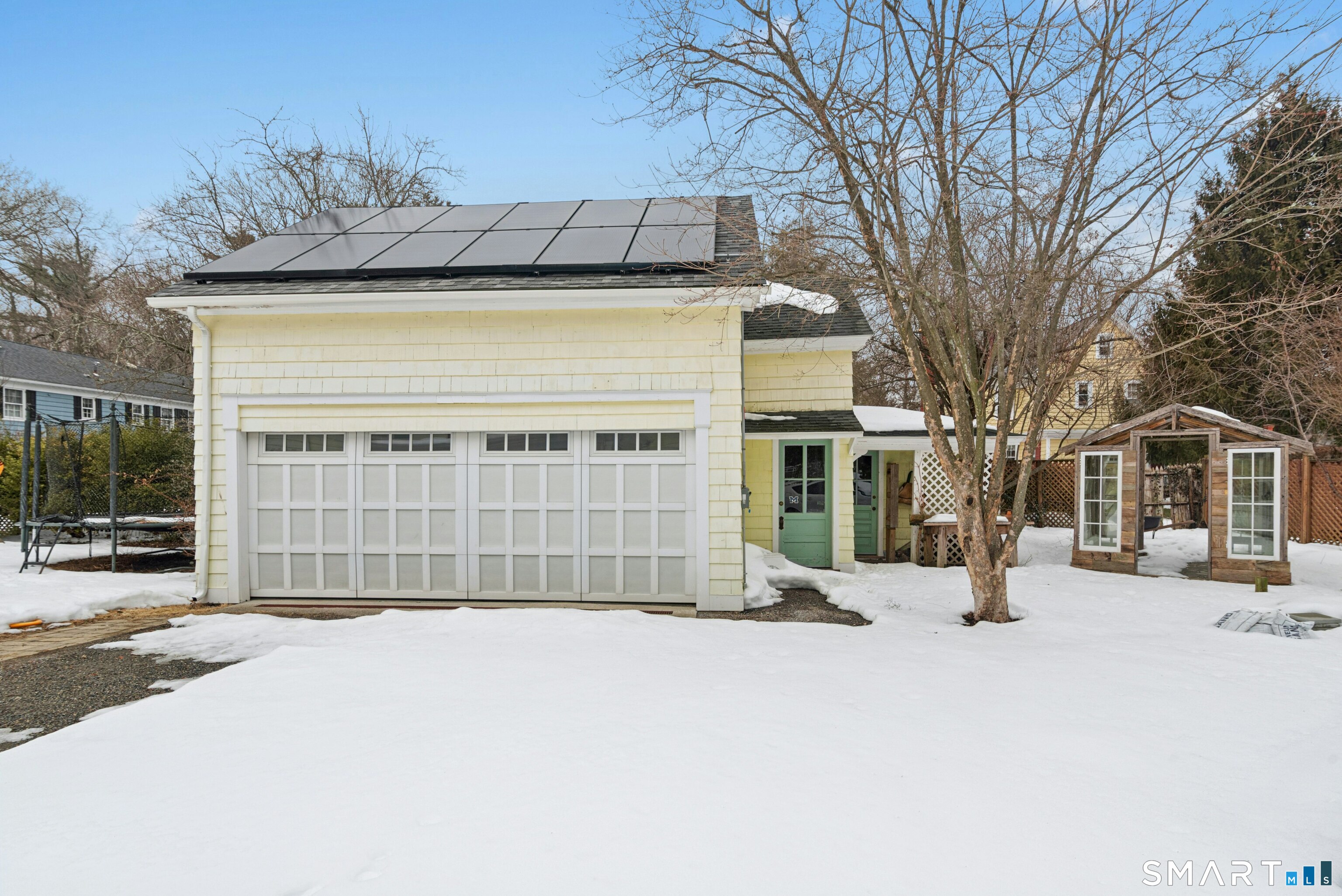 84 Algonquin Road Fairfield, CT 06825 - Photo 26 of 28 a front view of a house with a yard