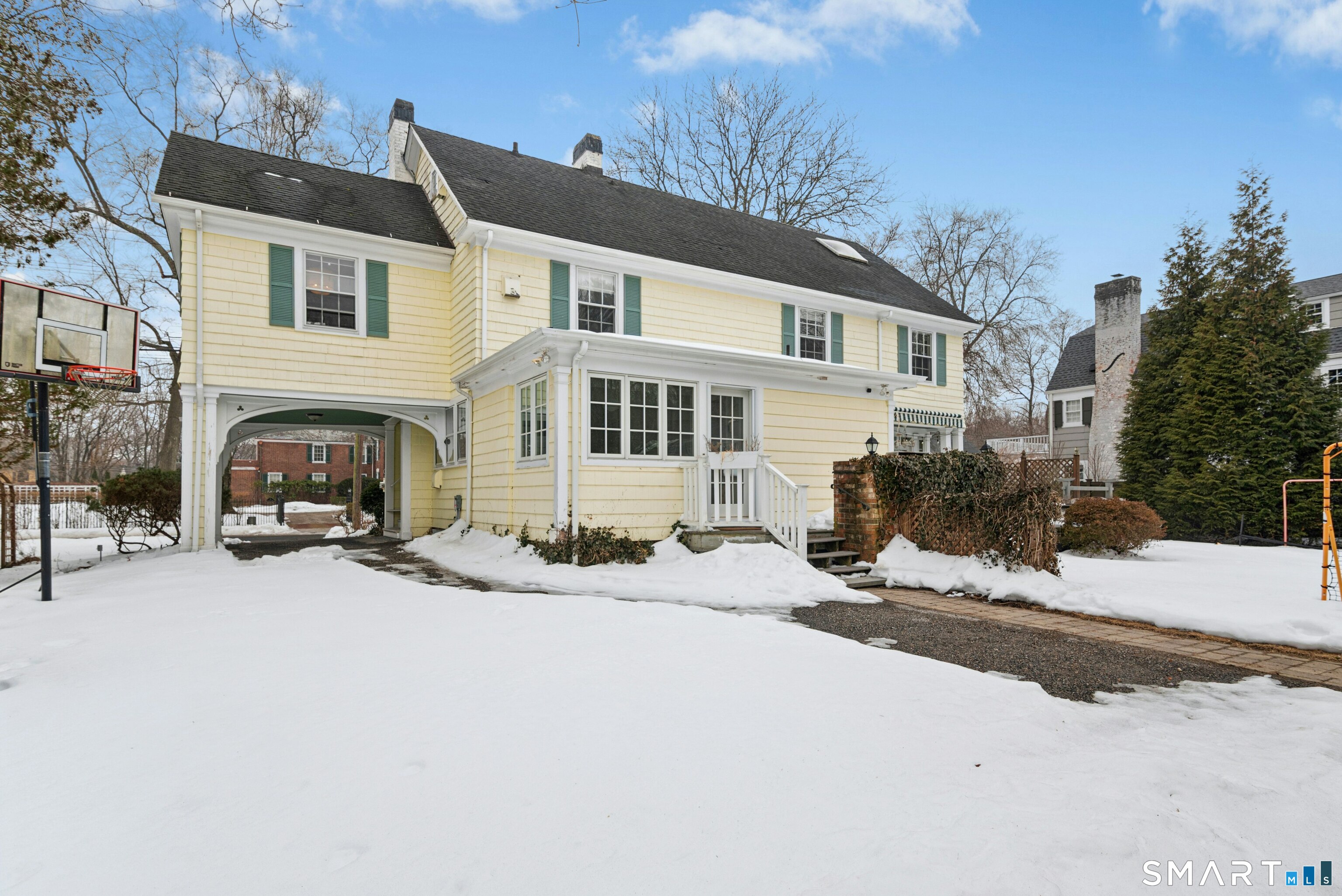 84 Algonquin Road Fairfield, CT 06825 - Photo 27 of 28 a view of a house with snow in front of house