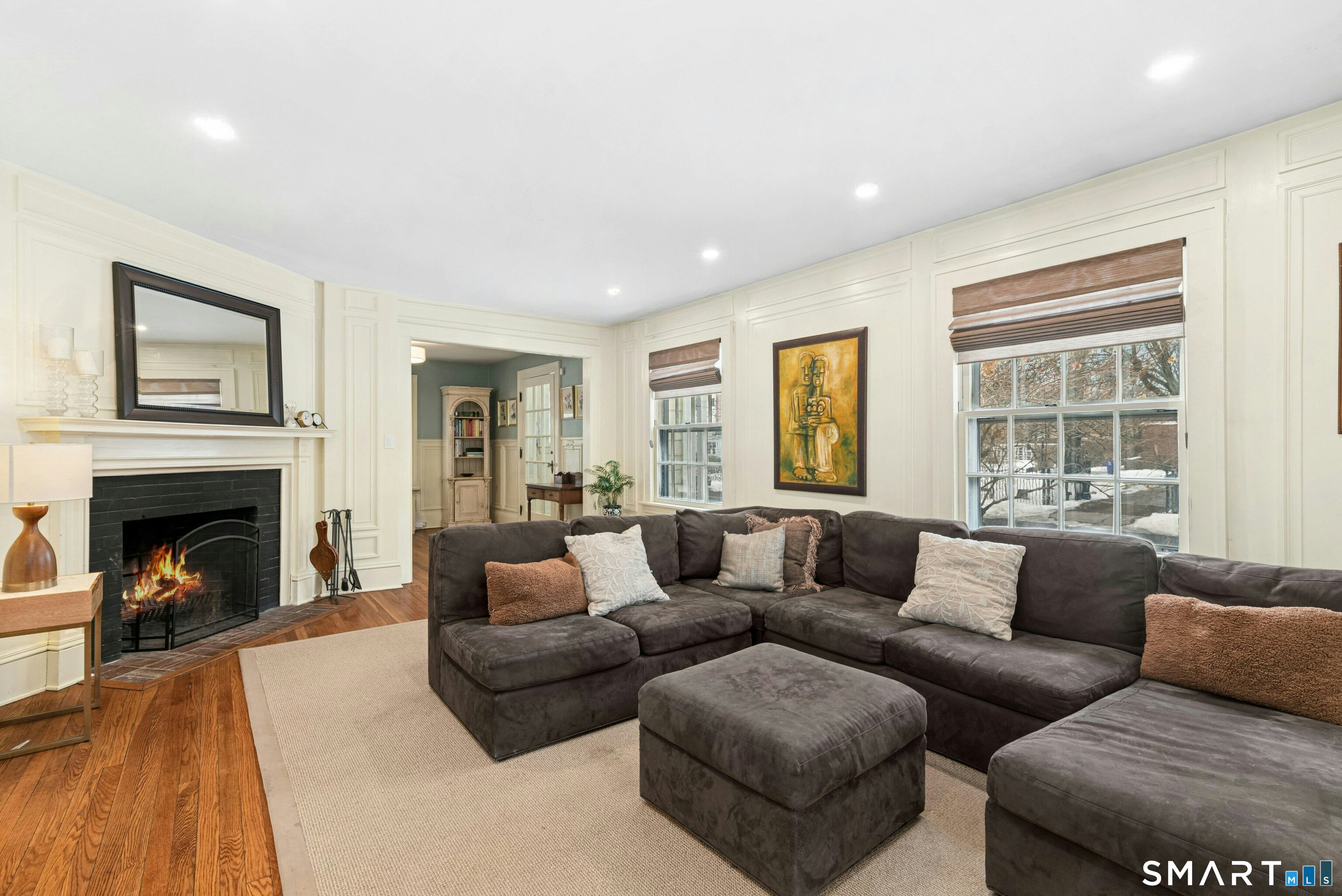 84 Algonquin Road Fairfield, CT 06825 - Photo 4 of 28 a living room with furniture and a fireplace