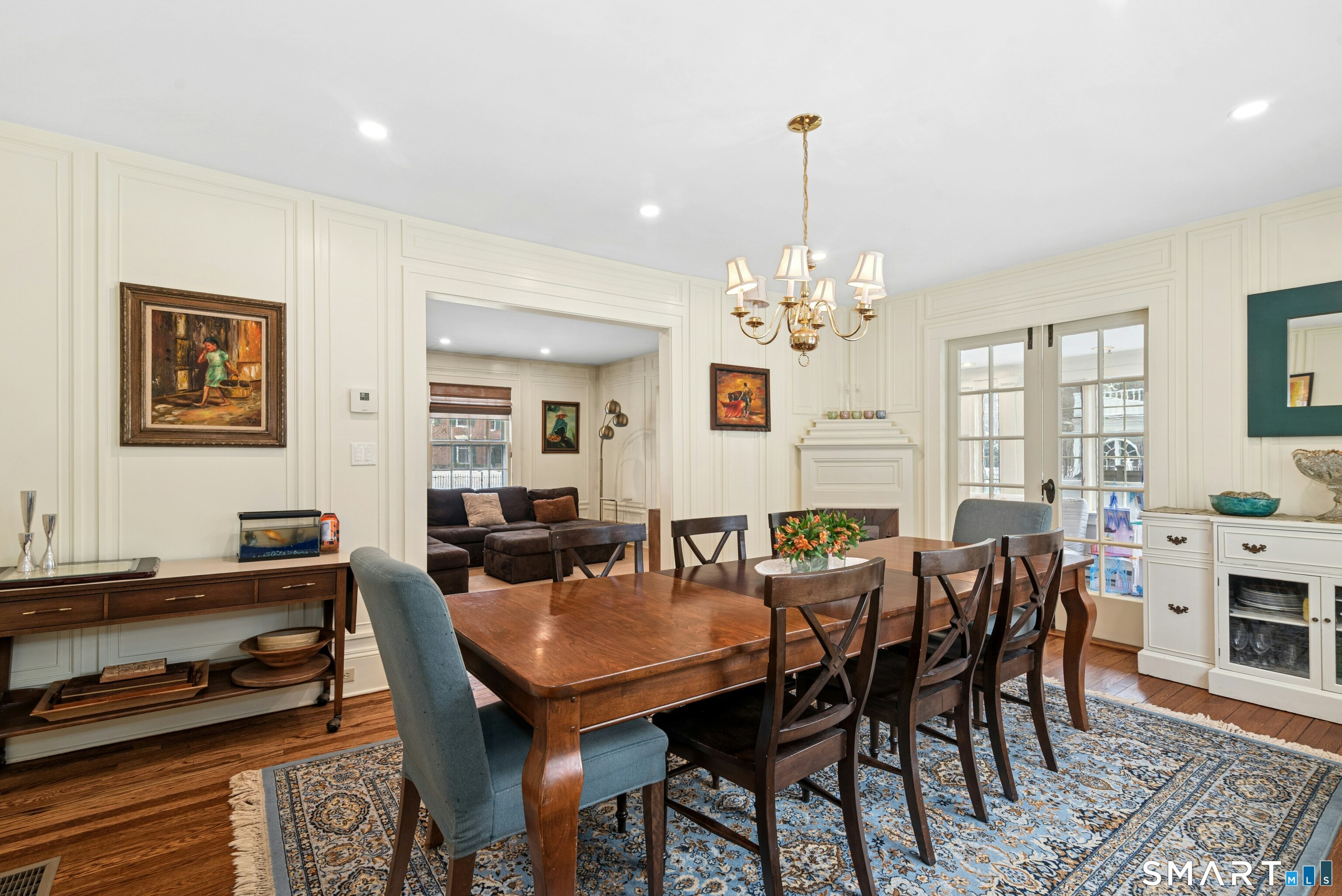 84 Algonquin Road Fairfield, CT 06825 - Photo 6 of 28 a view of a dining room with furniture and chandelier