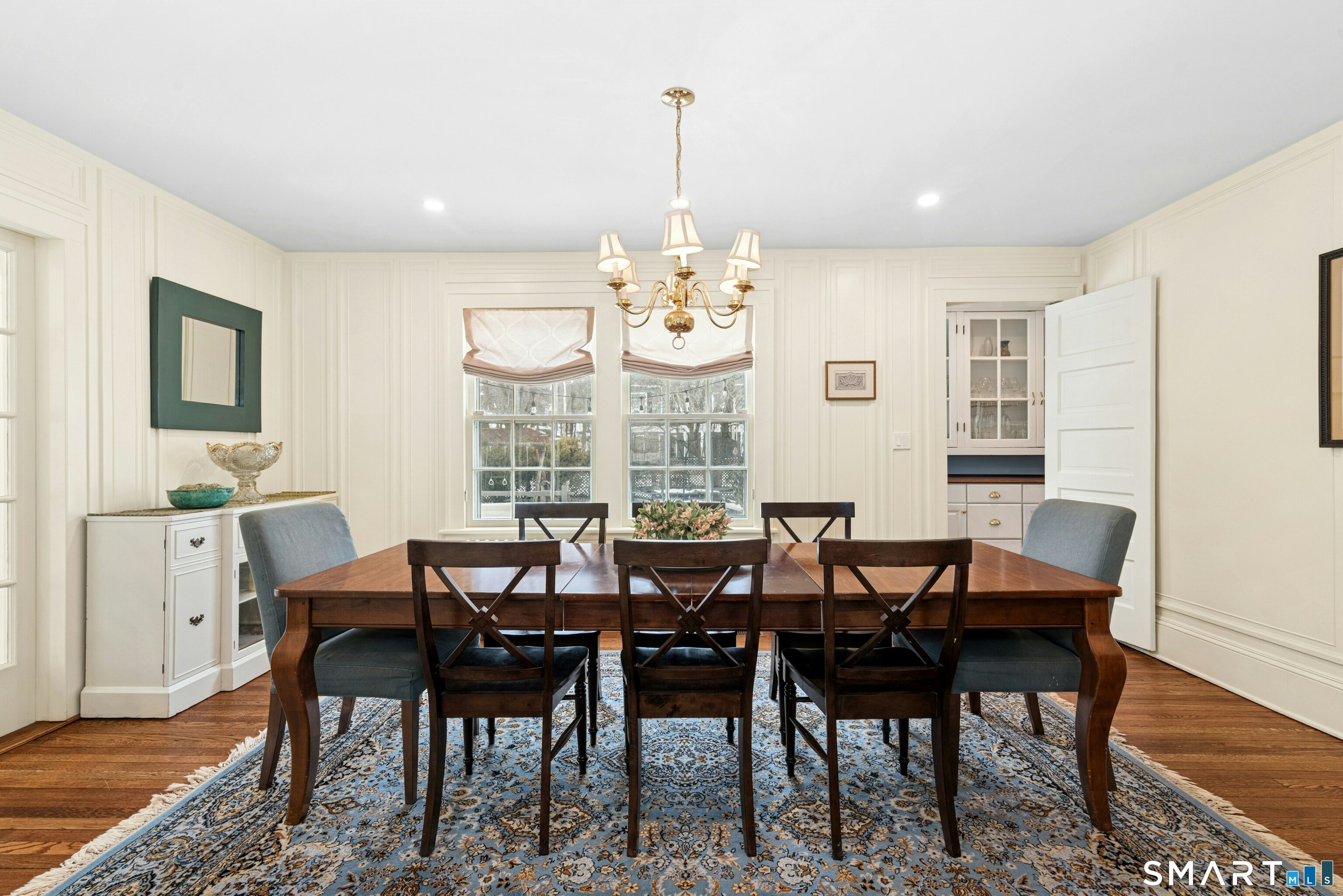 84 Algonquin Road Fairfield, CT 06825 - Photo 7 of 28 a view of a dining room with furniture wooden floor and chandelier