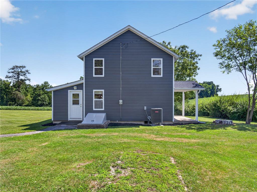 291 East Dannersville Road Bath, PA 18014 - Photo 10 of 46 A quaint residential dwelling with a lush green yard and expansive views of the surrounding fields.