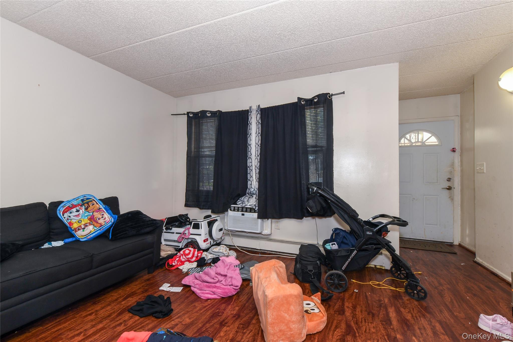 107-41 Sutphin Boulevard Queens, NY 11435 - Photo 15 of 19 Living room featuring wood finished floors