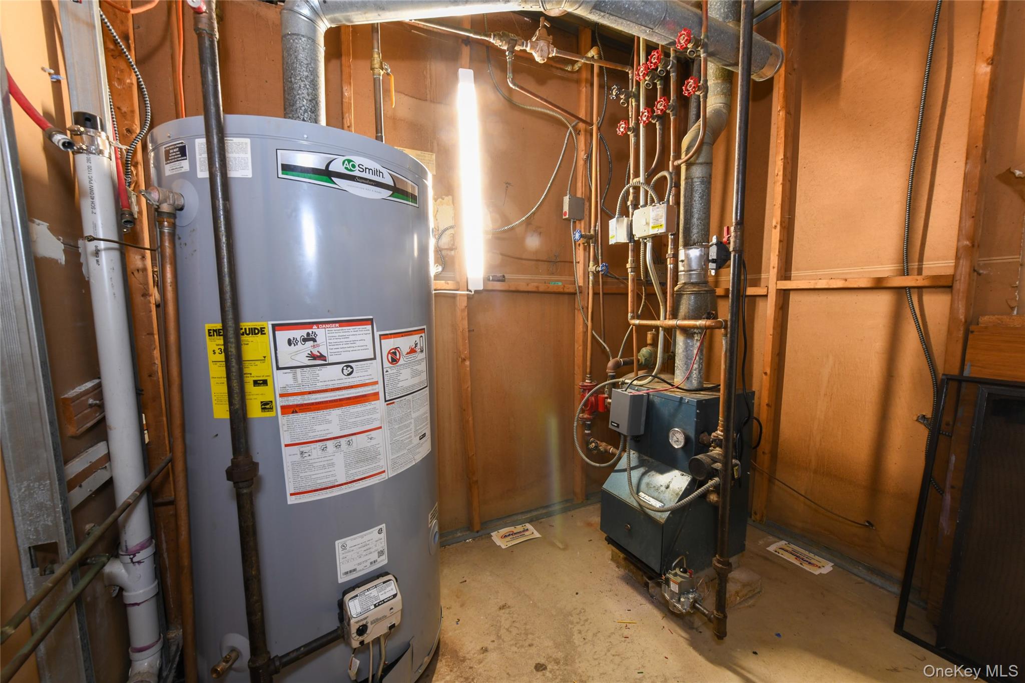 107-41 Sutphin Boulevard Queens, NY 11435 - Photo 19 of 19 Utility room featuring gas water heater