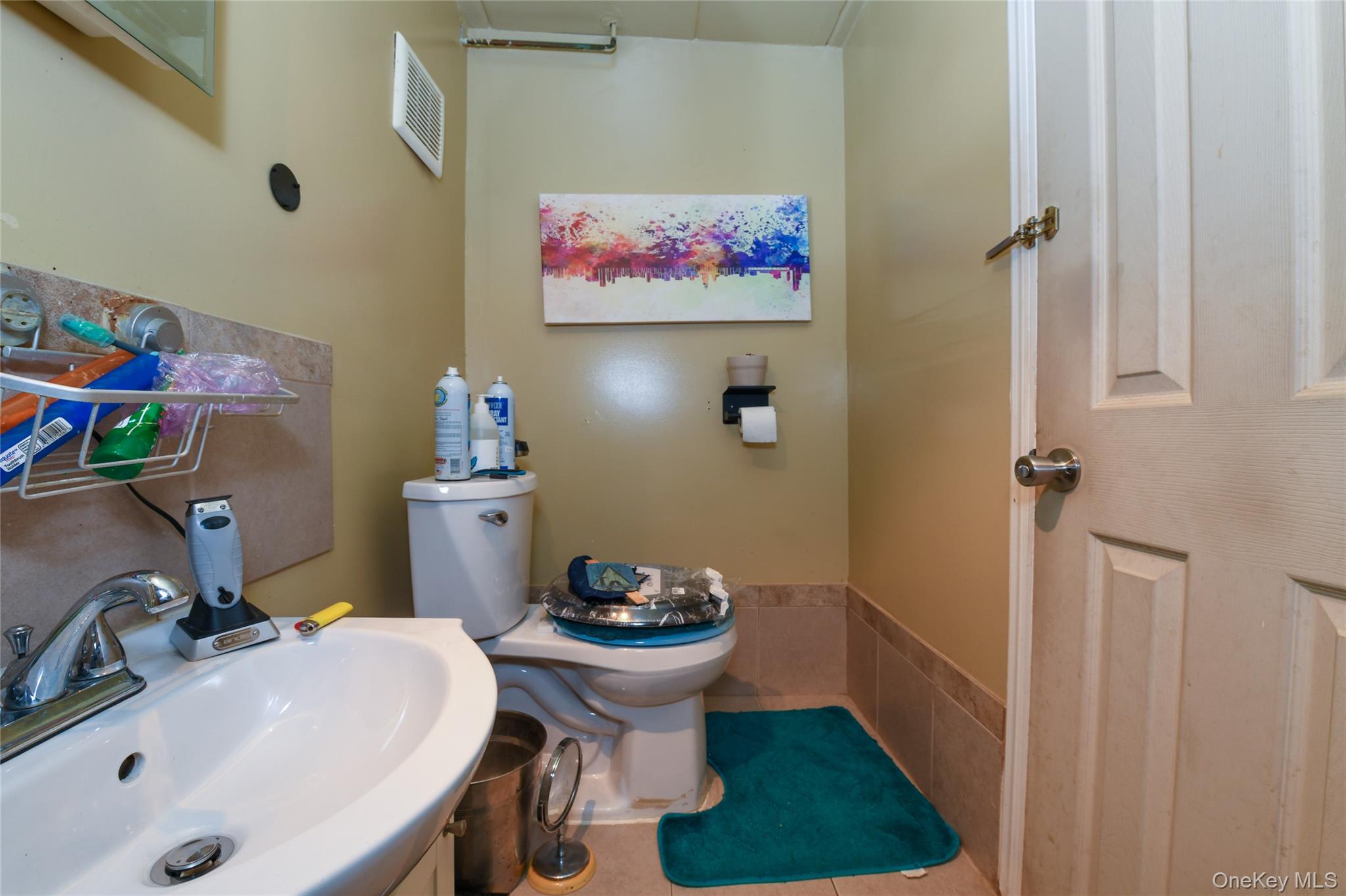 107-41 Sutphin Boulevard Queens, NY 11435 - Photo 9 of 19 Bathroom with toilet and tile patterned flooring