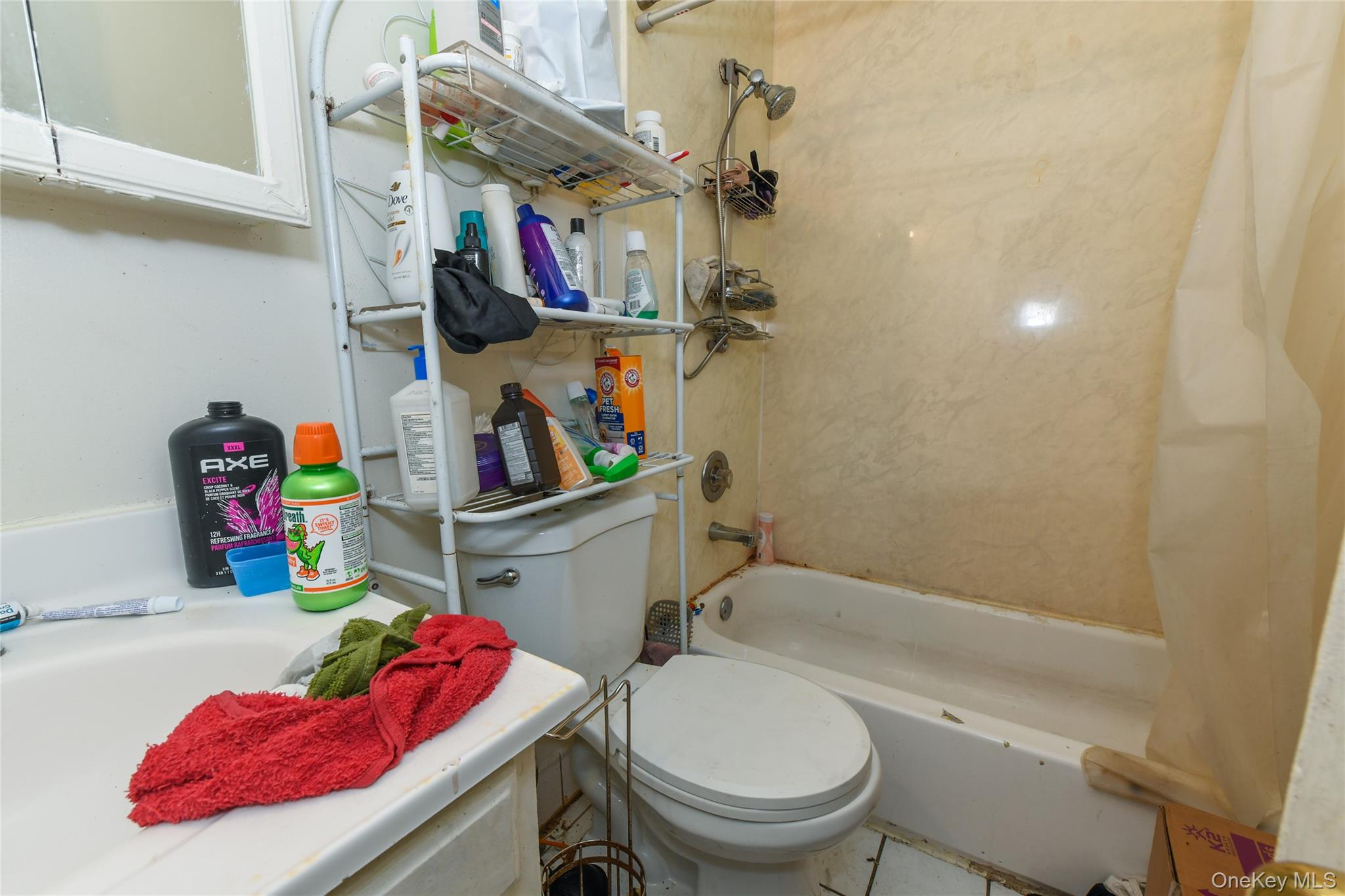 107-41 Sutphin Boulevard Queens, NY 11435 - Photo 10 of 19 Bathroom with shower / tub combo with curtain and tile patterned floors
