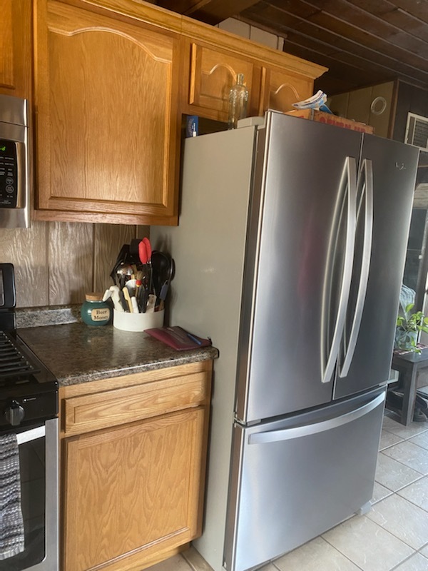 1765 West Mine Road Mazon, IL 60444 - Photo 10 of 21 a kitchen with a refrigerator and cabinets