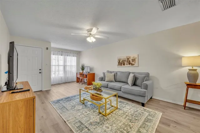 a living room with furniture and a window