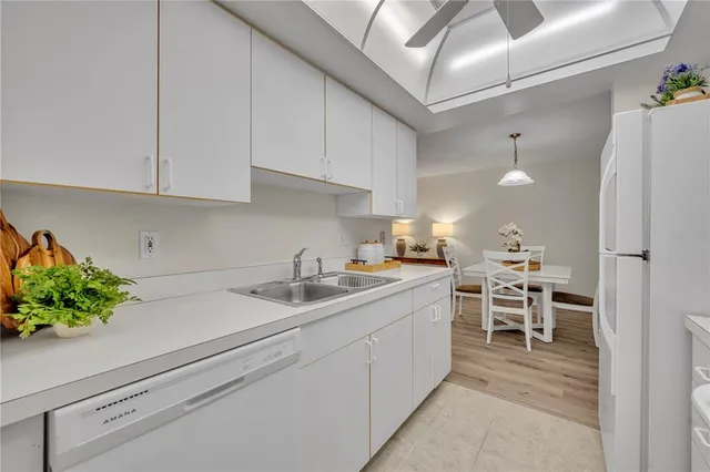 a kitchen with a sink and cabinets
