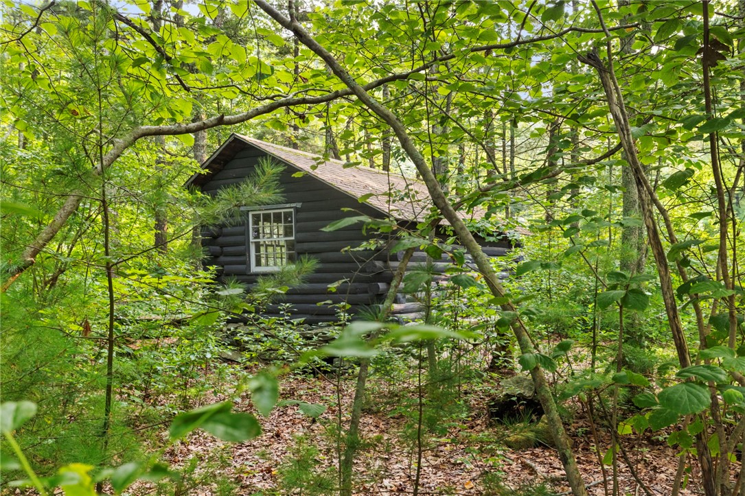 54 Pine Ledge Road Glocester, RI 02857 - Photo 31 of 44 Log cabin view