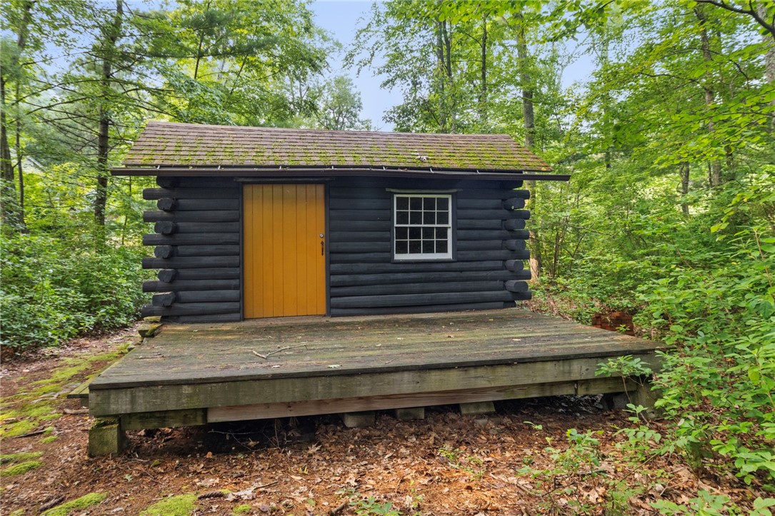 54 Pine Ledge Road Glocester, RI 02857 - Photo 32 of 44 Log cabin front