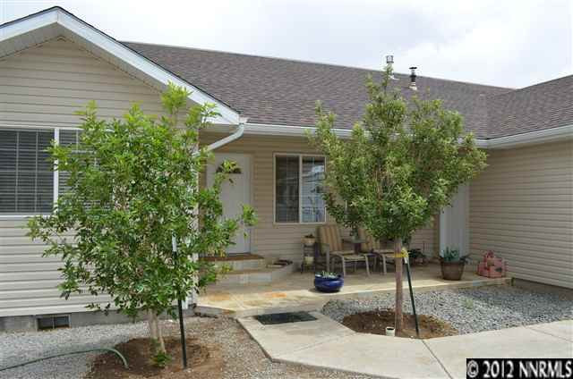 1213 Serpentine Road Reno, NV 89506 - Photo 1 of 1 a front view of a house with garden