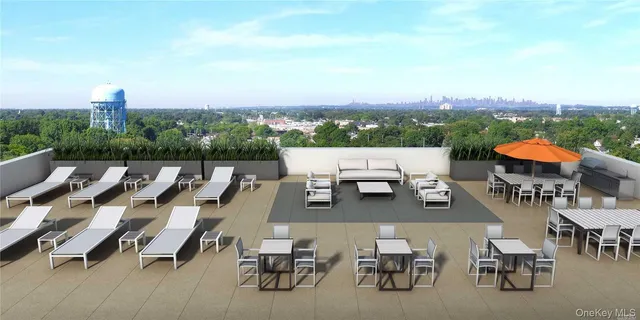 an aerial view of a terrace with outdoor seating and city view