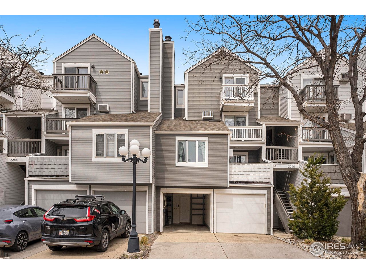 2254 Spruce Street, Unit A Boulder, CO 80302 - Photo 15 of 15 a front view of a house with a garden and parking space