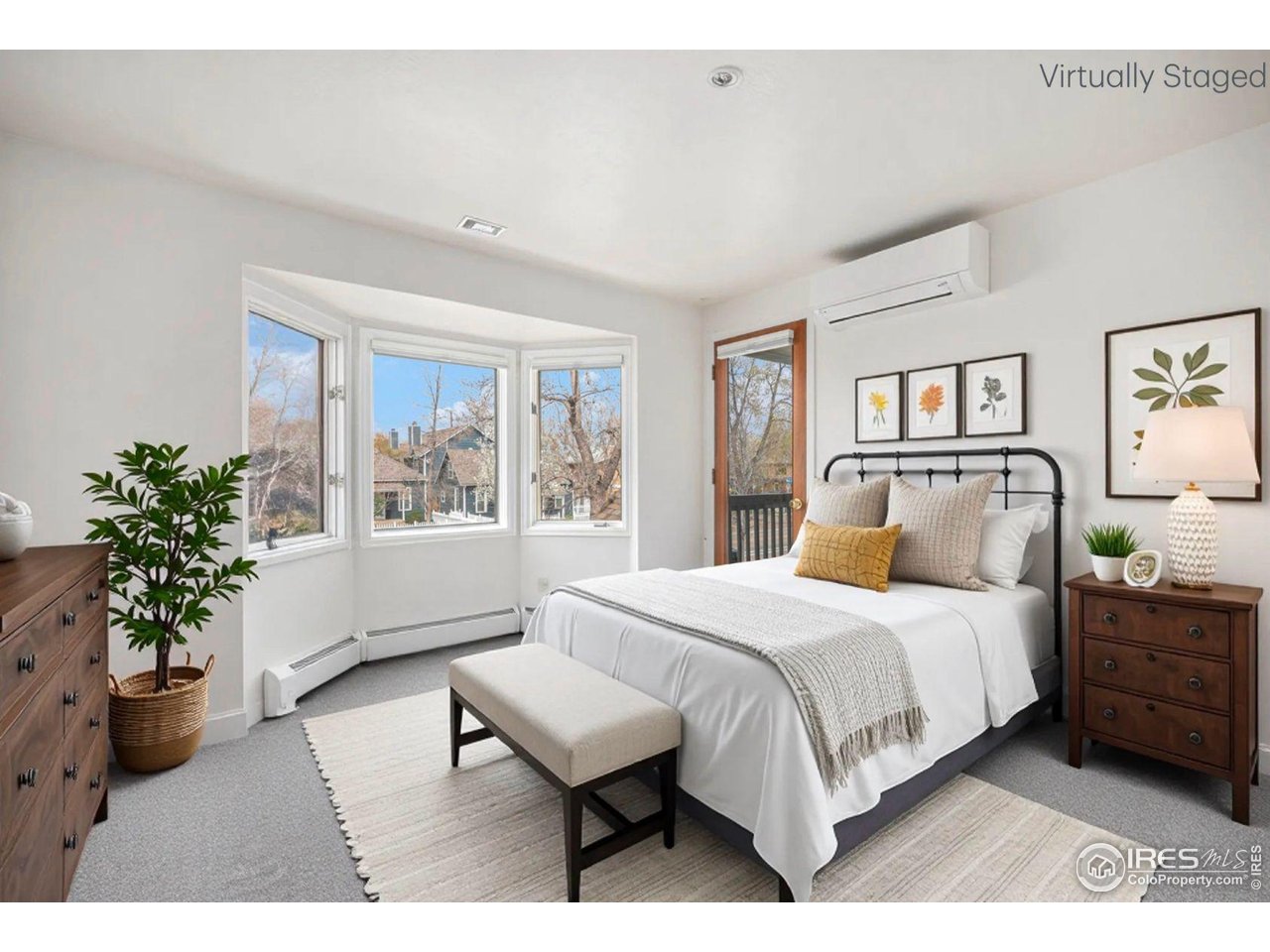 2254 Spruce Street, Unit A Boulder, CO 80302 - Photo 6 of 15 a bedroom with a large bed and a potted plant