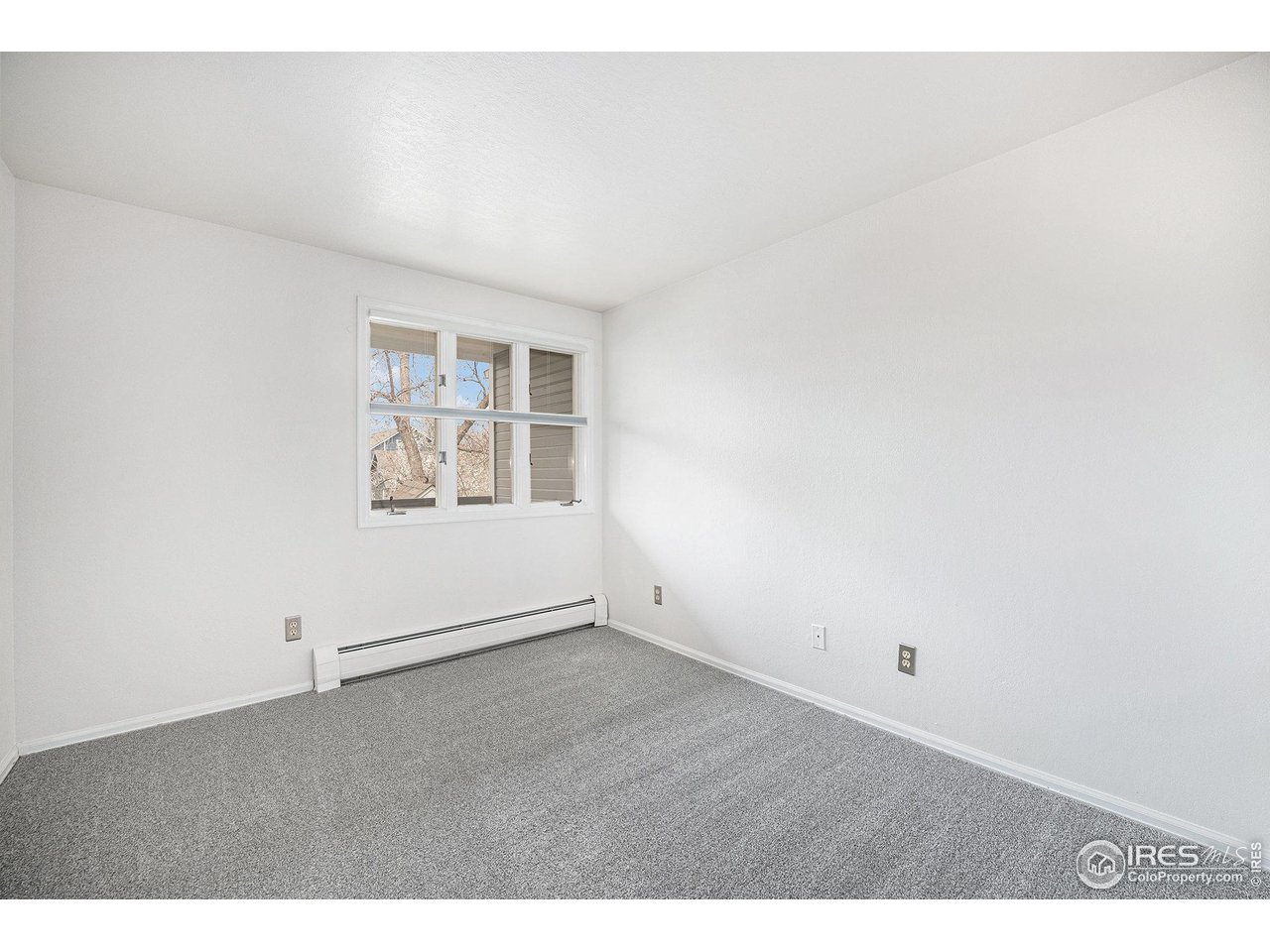 2254 Spruce Street, Unit A Boulder, CO 80302 - Photo 9 of 15 an empty room with windows