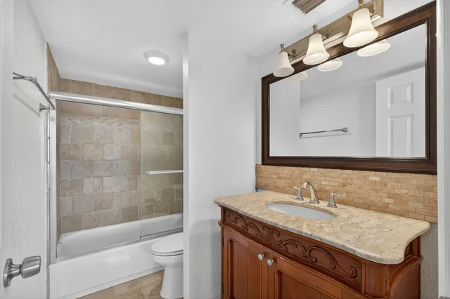 a bathroom with a shower and a toilet