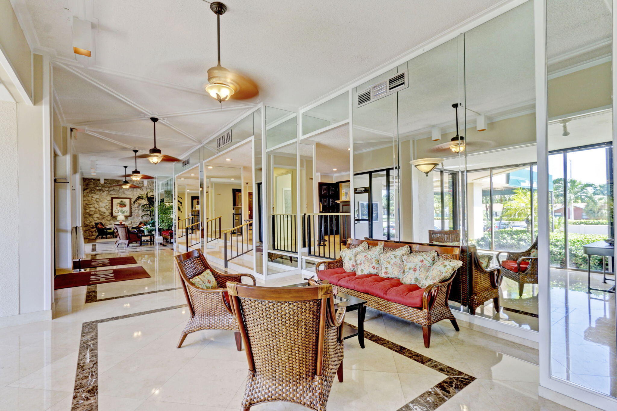 5600 North Flagler Drive, Unit 2703 West Palm Beach, FL 33407 - Photo 29 of 60 a living room with patio and dining table