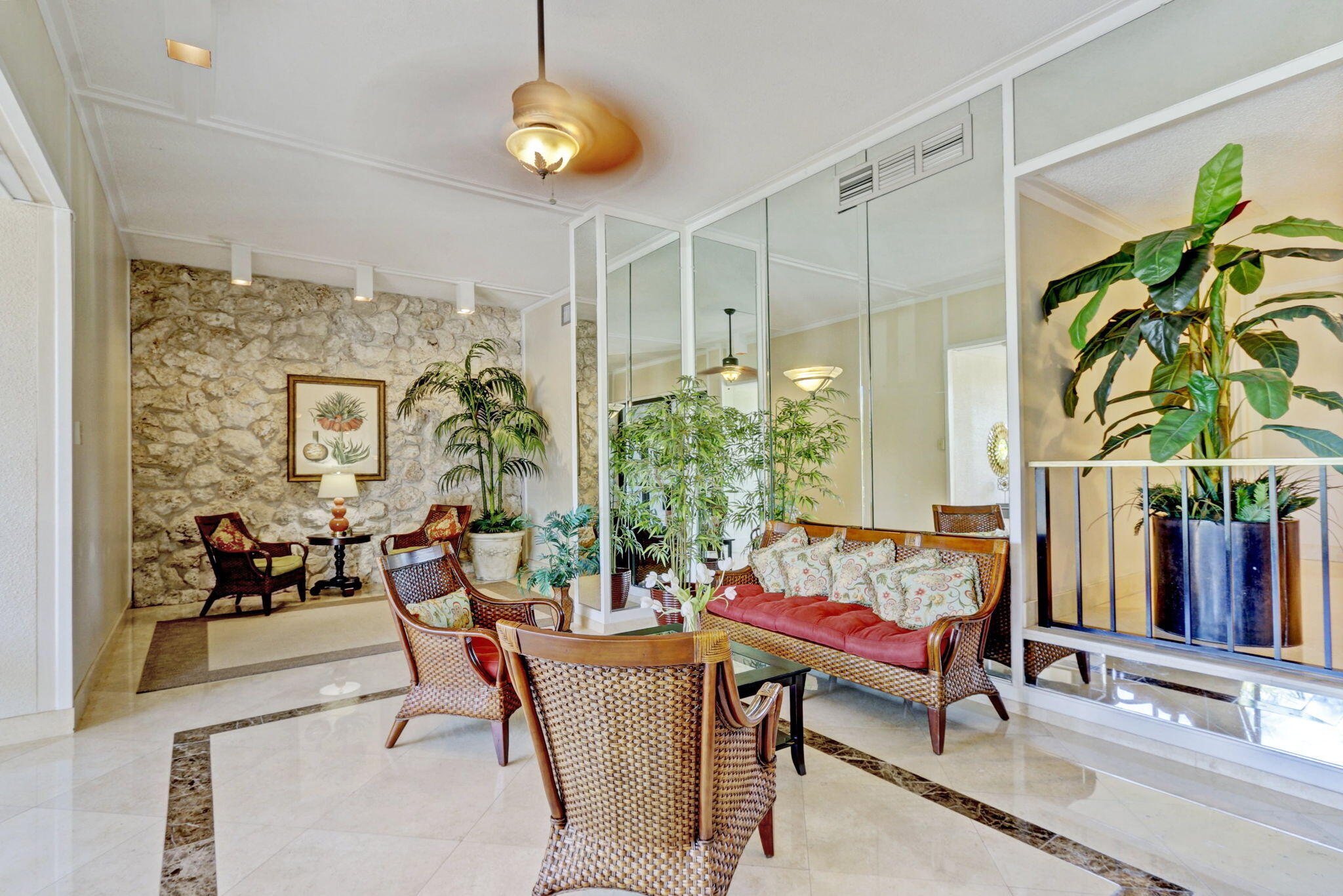 5600 North Flagler Drive, Unit 2703 West Palm Beach, FL 33407 - Photo 30 of 60 a living room with patio furniture and a potted plants