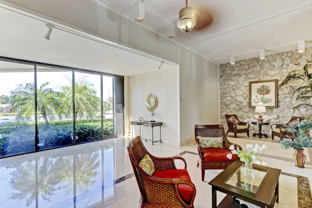 a room with lots of furniture and a chandelier