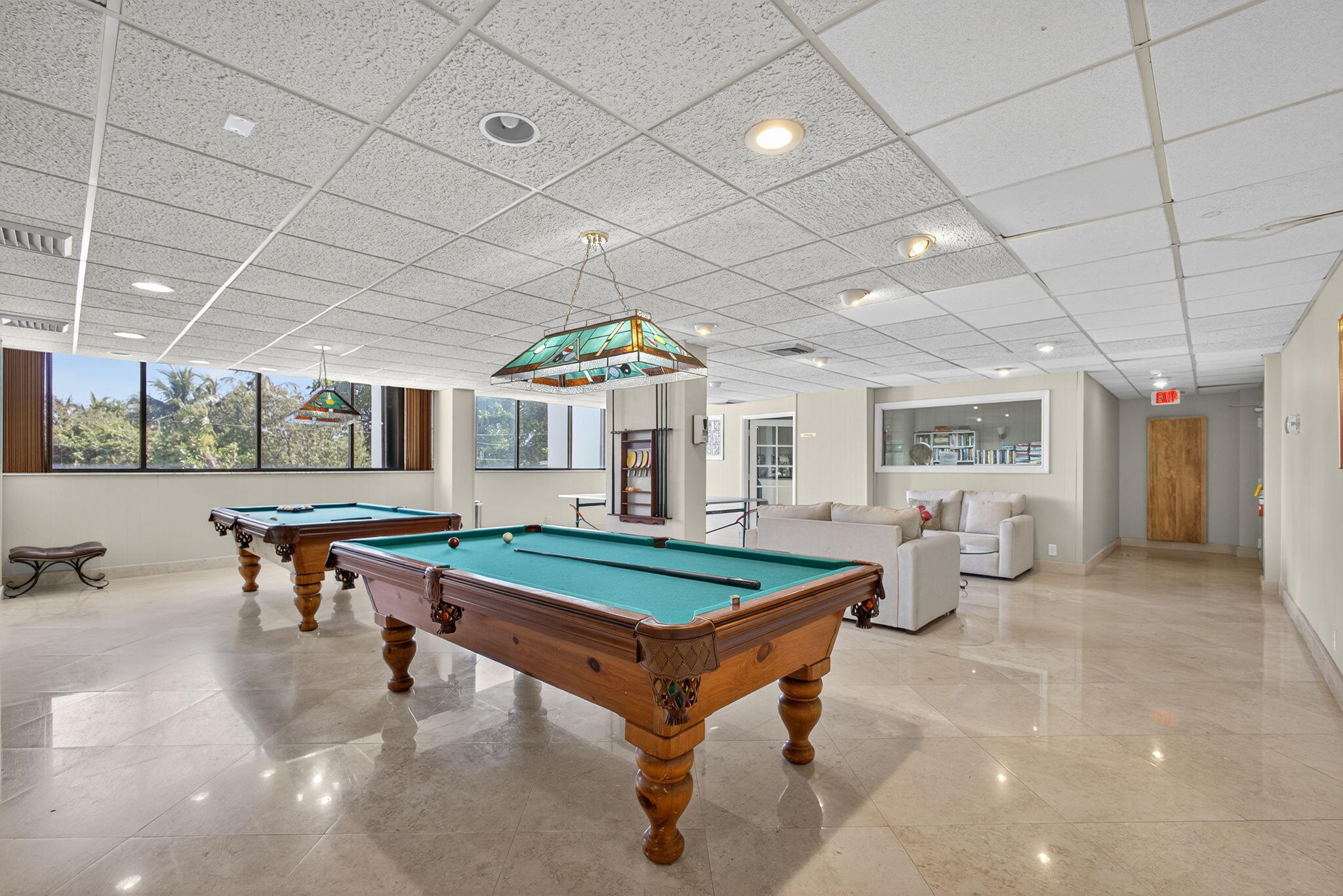 5600 North Flagler Drive, Unit 2703 West Palm Beach, FL 33407 - Photo 37 of 60 a room with lots of furniture and a chandelier